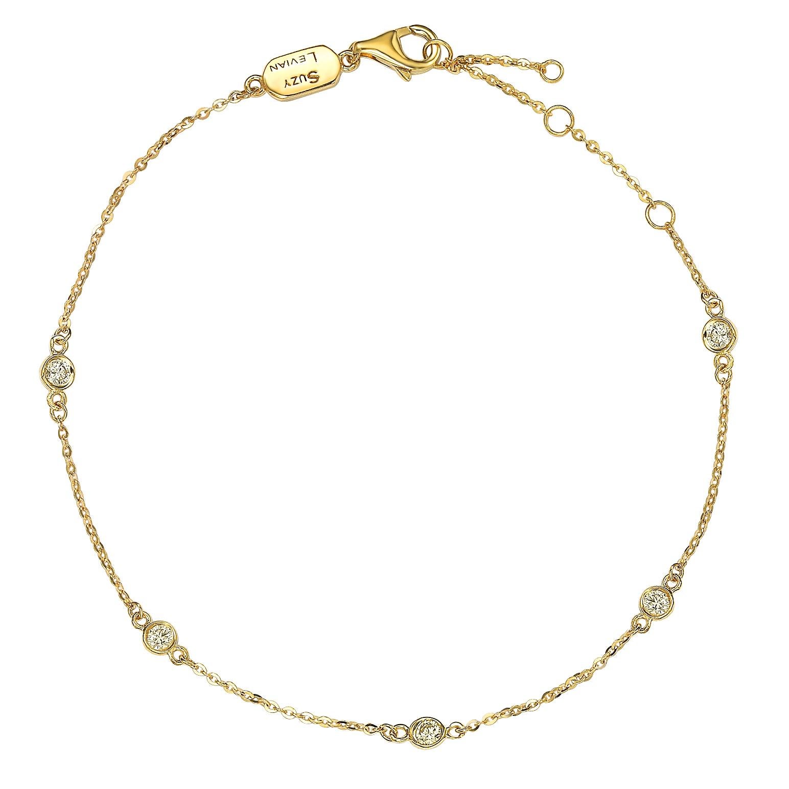 This elegant bracelet features a five round-cut diamonds on a thin 14 karat yellow gold chain. A high polish finish completes the look. This bracelet has the adjustable length options of 6.5, 7, and 7.5 to better fit every wrist. 

White