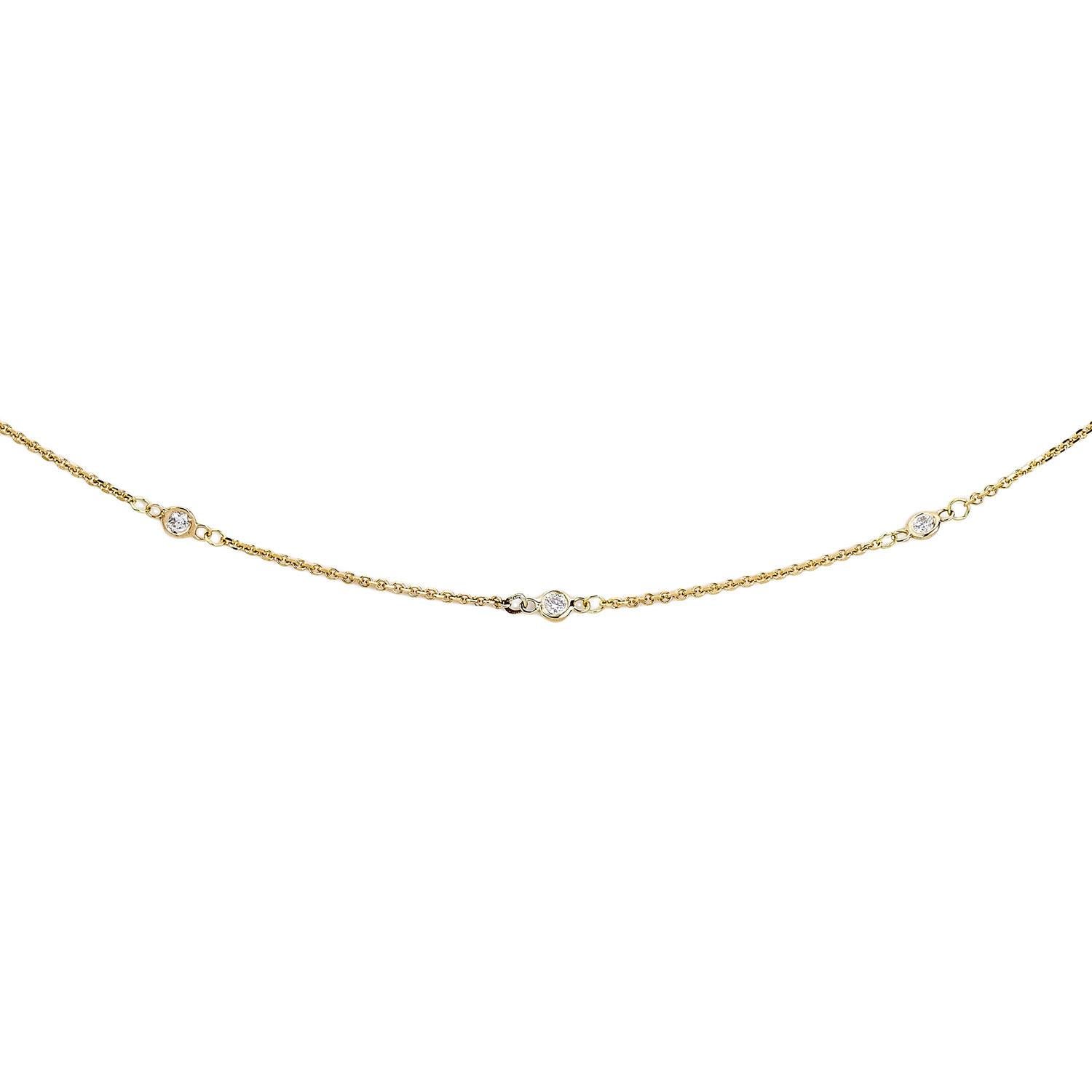 Offrez-vous ou offrez à la personne de votre choix l'élégance de ce collier en or 14 carats et diamants, qui comporte 12 diamants régulièrement espacés. Choisissez parmi plusieurs couleurs d'or pour compléter les diamants. La finition polie de l'or