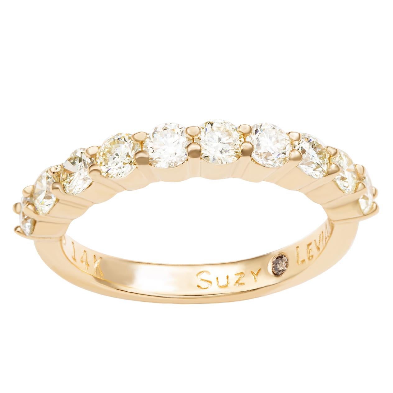 This elegant Suzy Levian diamond half eternity band features a total of ten round cut diamonds (G-H, S1-S2). The diamonds sparkle along half the eternity band, for a sparkle you can't miss with a comfort fit. Designed by Suzy Levian , this 14k