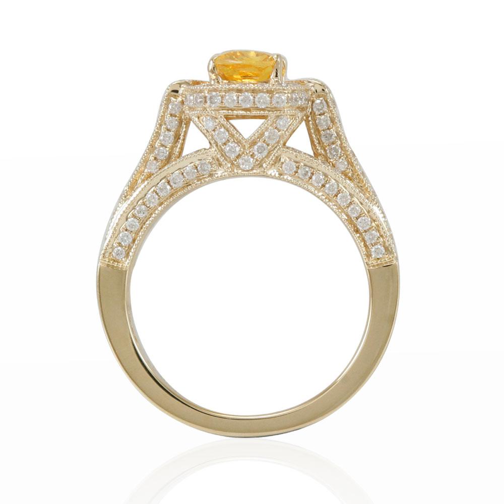 Get some attention when you wear this beautiful Suzy Levian yellow sapphire ring. This ring has a unique yellow cushion-cut sapphire (1.43ct) with diamonds accents along an intricate setting. A lustrous French crown design completes the ring. This