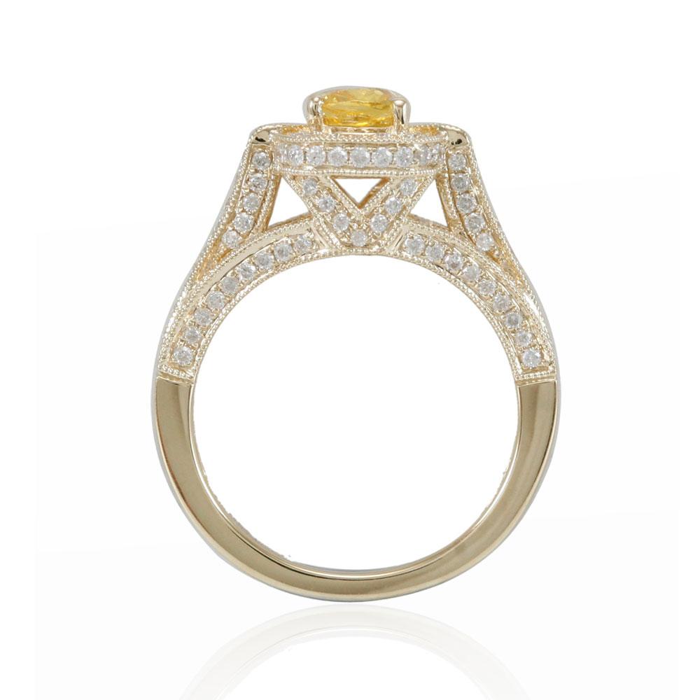 Get some attention when you wear this beautiful Suzy Levian yellow sapphire ring. This ring has a unique yellow cushion-cut sapphire (1.59ct) with diamonds accents along an intricate setting. A lustrous French crown design completes the ring. This