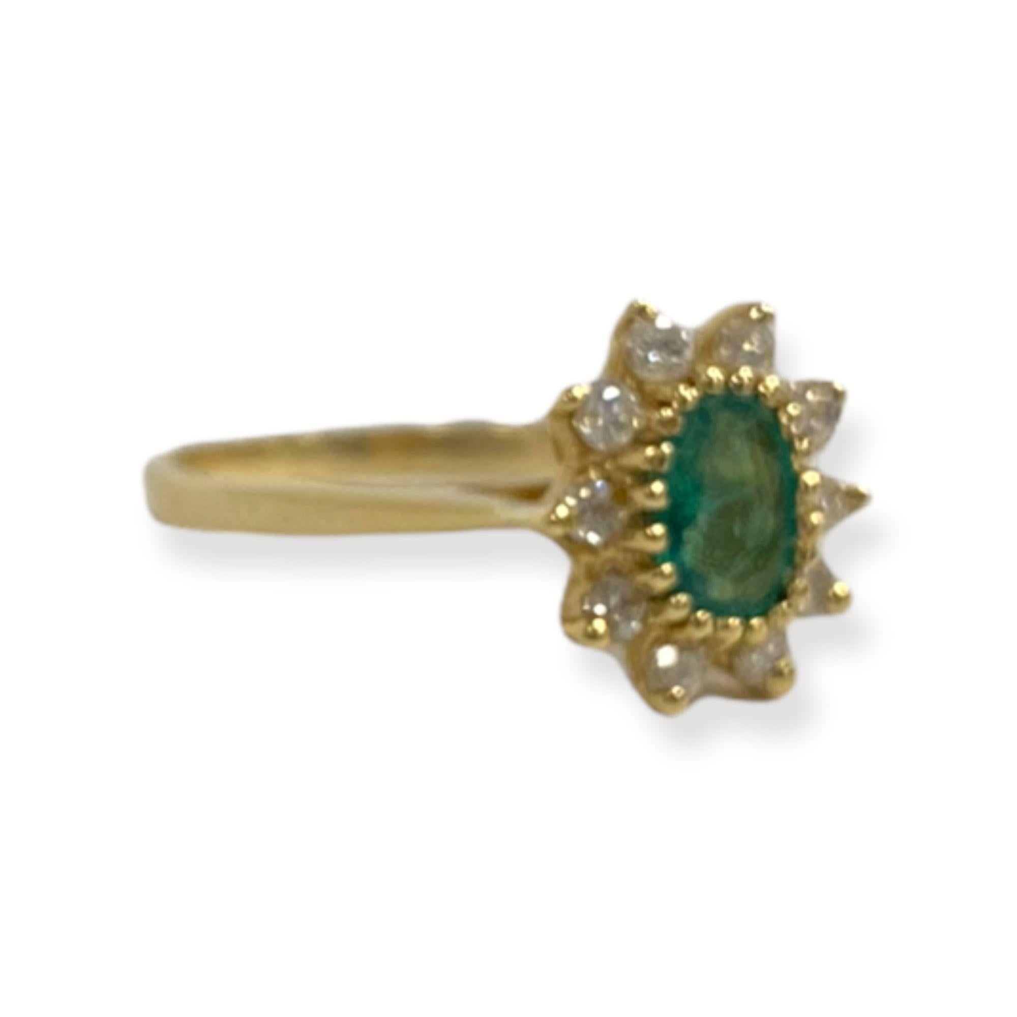 This spectacular ring from the Suzy Levian collection features 14k gold. An array of white diamonds (.15cttw) accent the perfect green color of the emerald gemstone center stone (.75ct) The brilliance of these gems and the luster of the high-polish