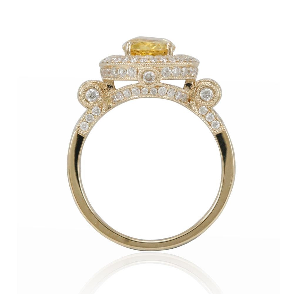 Fit for all occasions, this amazing ring from Suzy Levian features a sparkling natural, oval-cut yellow sapphire as its centerpiece. The oval-cut stone (1.63 ct) is surrounded by 115 round-cut diamonds (.91cttw) (H-I, SI1-2), creating a double halo