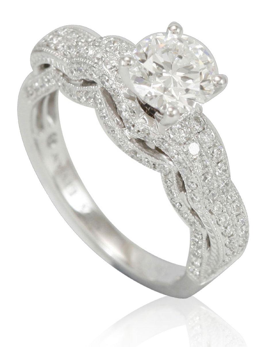 This spectacular ring from the Suzy Levian Limited Edition collection features a 18k white gold setting with a round-cut, fancy diamond center stone (1.16ct) . An array of white diamonds (.86cttw) accents the ring perfectly as the brilliance of