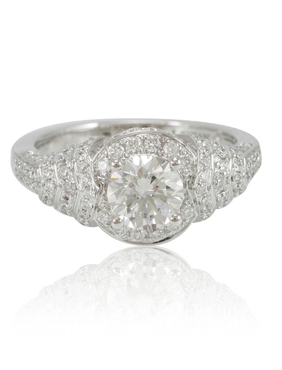 This spectacular ring from the Suzy Levian collection features a 18k white gold setting with a round-cut diamond center stone (1.02ct) . An array of white diamonds (.88cttw) accents the ring perfectly as the brilliance of these diamonds and the