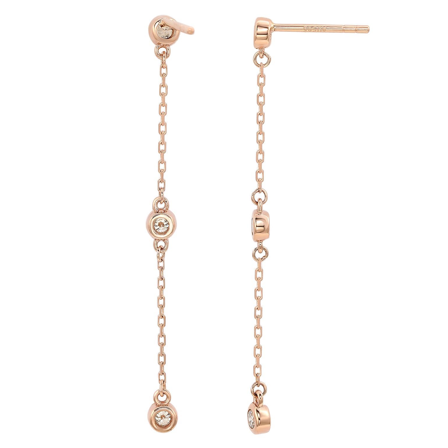 A touch of dazzle and a lot of style, these dangle earrings add a fashionable touch to any attire. Sleek and polished in solid rose gold, these stylish earrings showcase a station design of bezel set 6 round cut white diamonds totaling 4/5 CTTW.