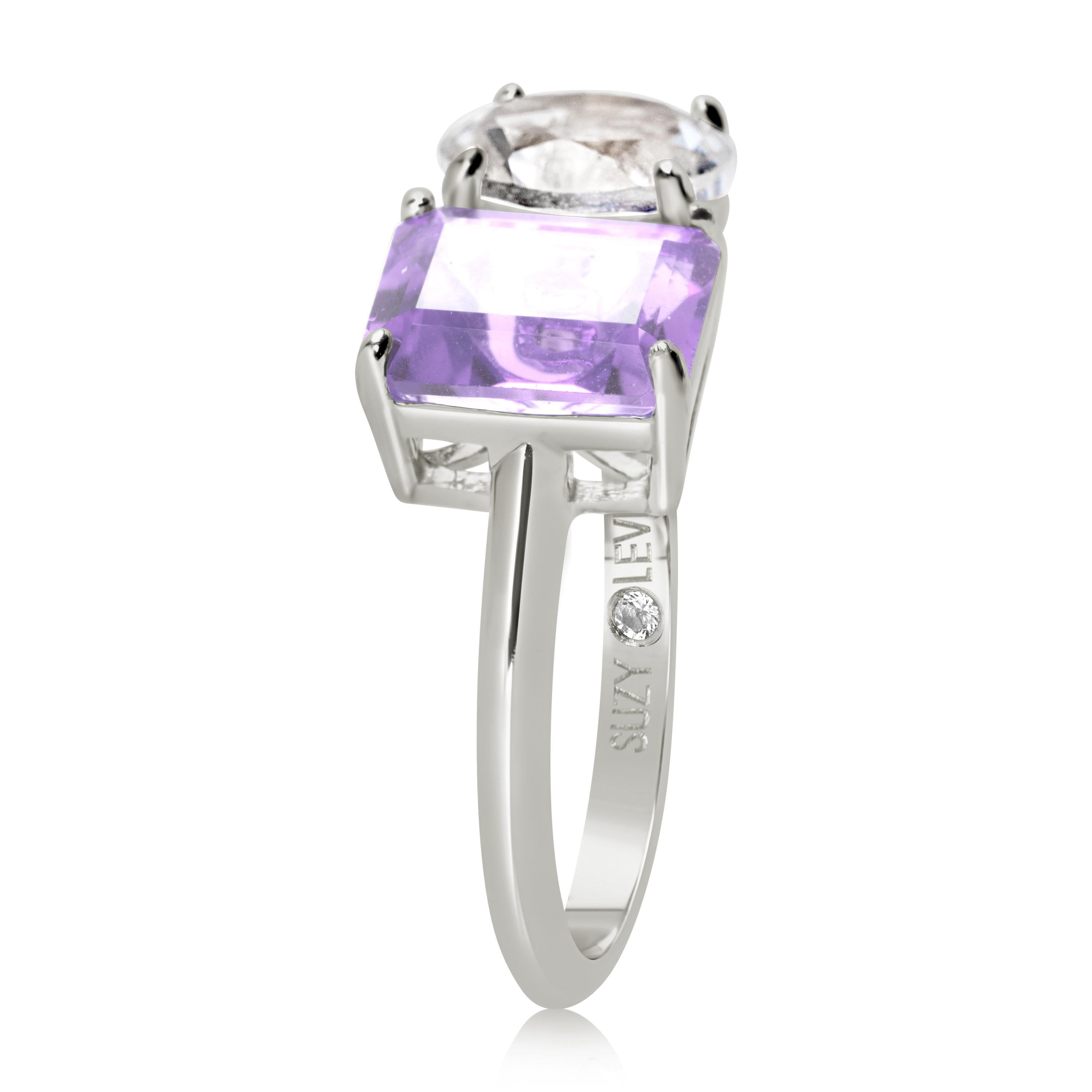 Shimmering in hues of white and purple, this Suzy Levian ring is as on trend as can be, and features a round cut white topaz and an emerald cut purple amethyst as a perfectly matched pair. This ring symbolizes a perfect pairing of unique shapes.