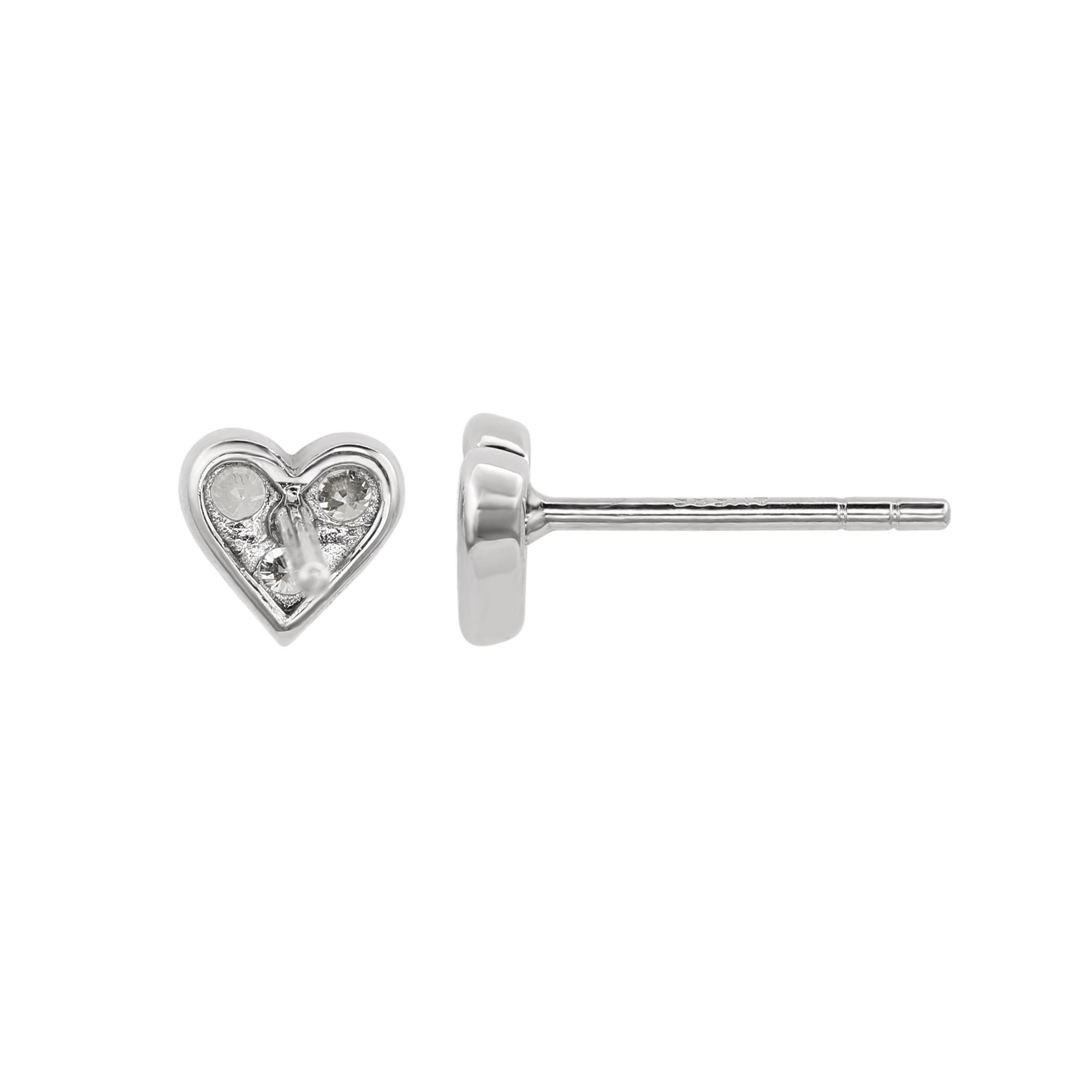 Add an elegant accent to your outfit with these sparkling Suzy Levian heart shape stud earrings featuring six round cut gorgeous white diamonds in a prong setting. The sparkling diamonds are hand set in 14-karat white gold, and weigh 0.30 cttw and