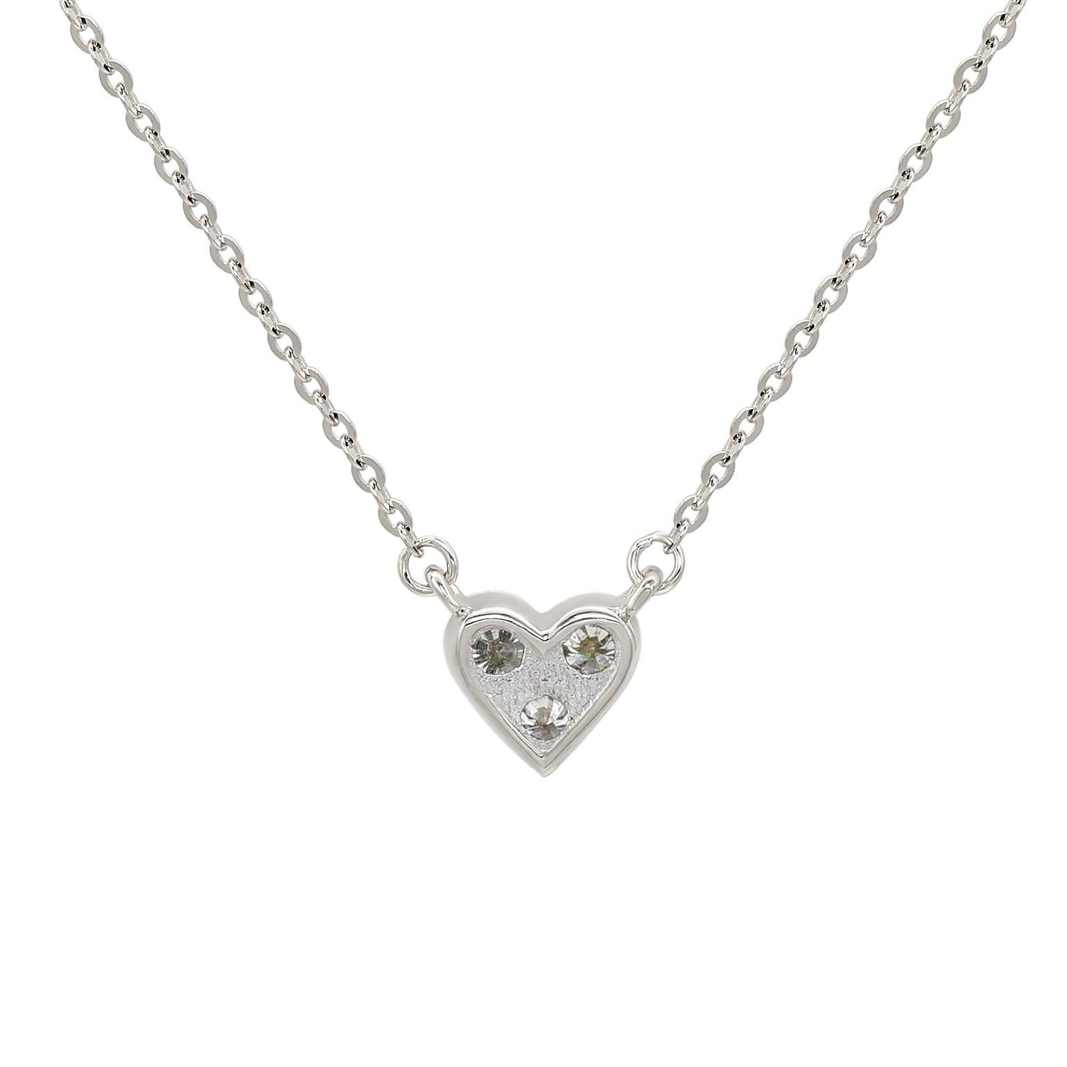 Add an elegant accent to your outfit with this sparkling Suzy Levian heart shape necklace featuring 3 round cut gorgeous white diamonds in a prong setting. The sparkling diamonds are hand set in 14-karat white gold, and weigh 0.18 cttw and are g-h,