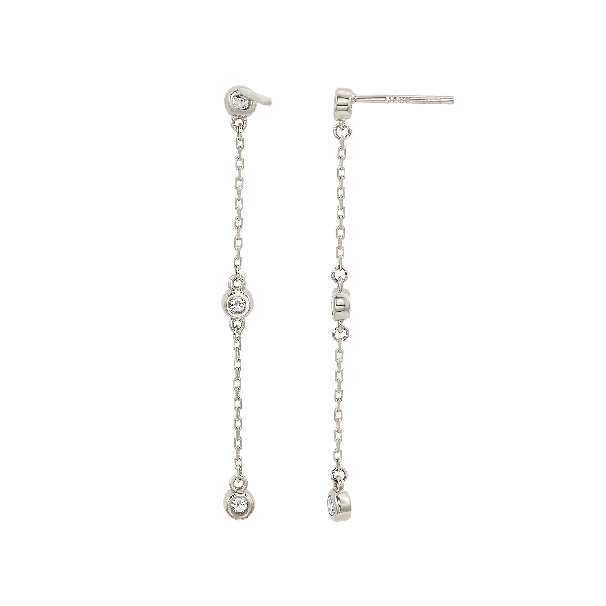 A touch of dazzle and a lot of style, these dangle earrings add a fashionable touch to any attire. Sleek and polished in solid white gold, these stylish earrings showcase a station design of bezel set 6 round cut white diamonds totaling 4/5 CTTW.