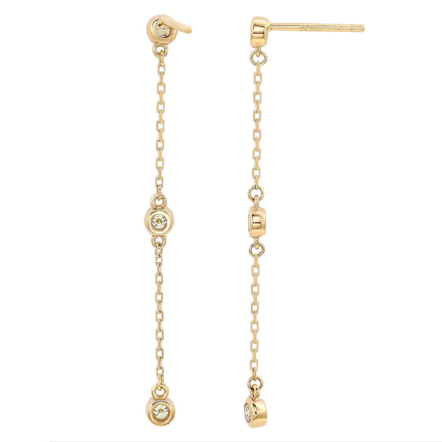 A touch of dazzle and a lot of style, these dangle earrings add a fashionable touch to any attire. Sleek and polished in solid yellow gold, these stylish earrings showcase a station design of bezel set 6 round cut white diamonds totaling 4/5 CTTW.