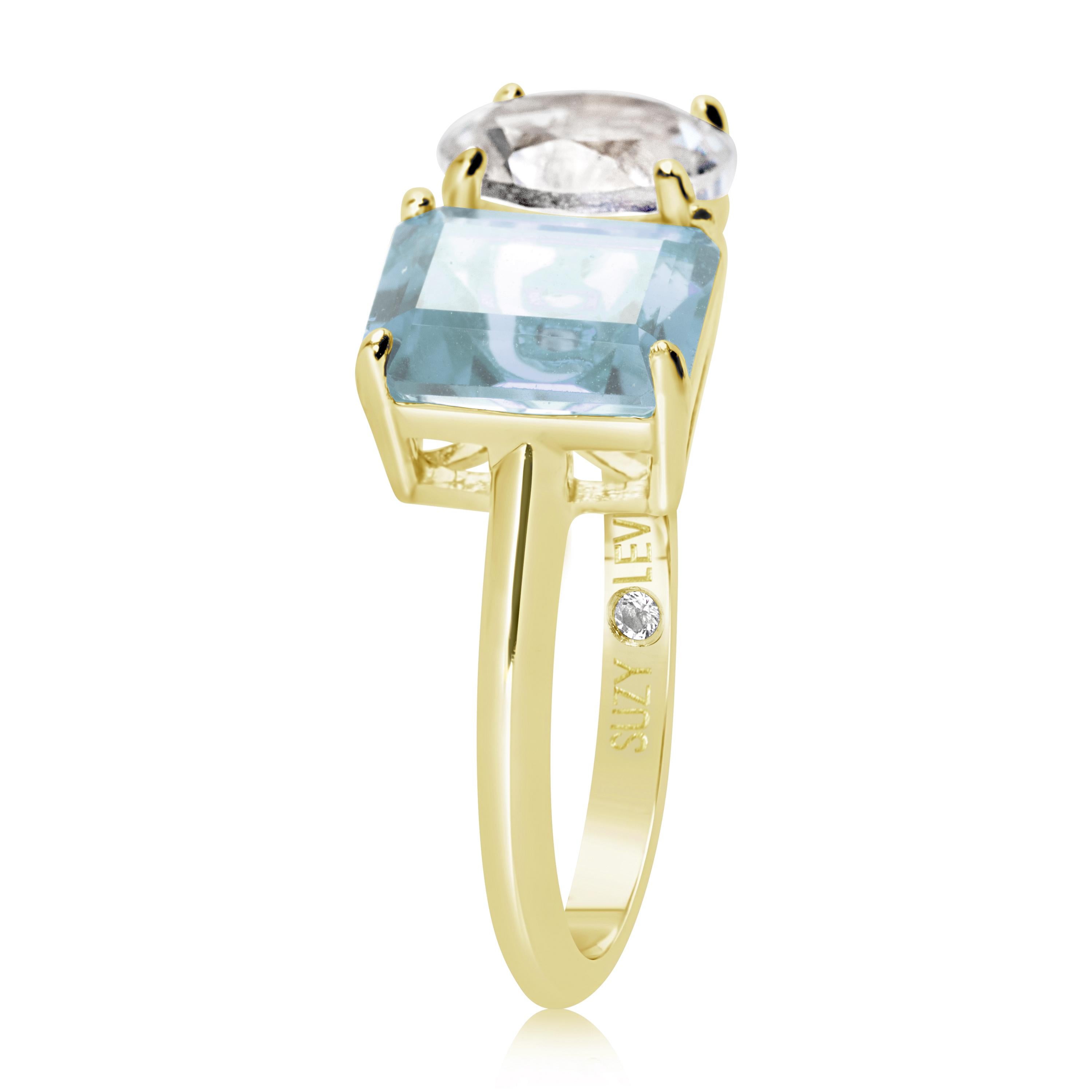 Shimmering in hues of white and blue, this Suzy Levian ring is as on trend as can be, and features a round cut white topaz and an emerald cut blue topaz as a perfectly matched pair. This ring symbolizes a perfect pairing of unique shapes. This ring