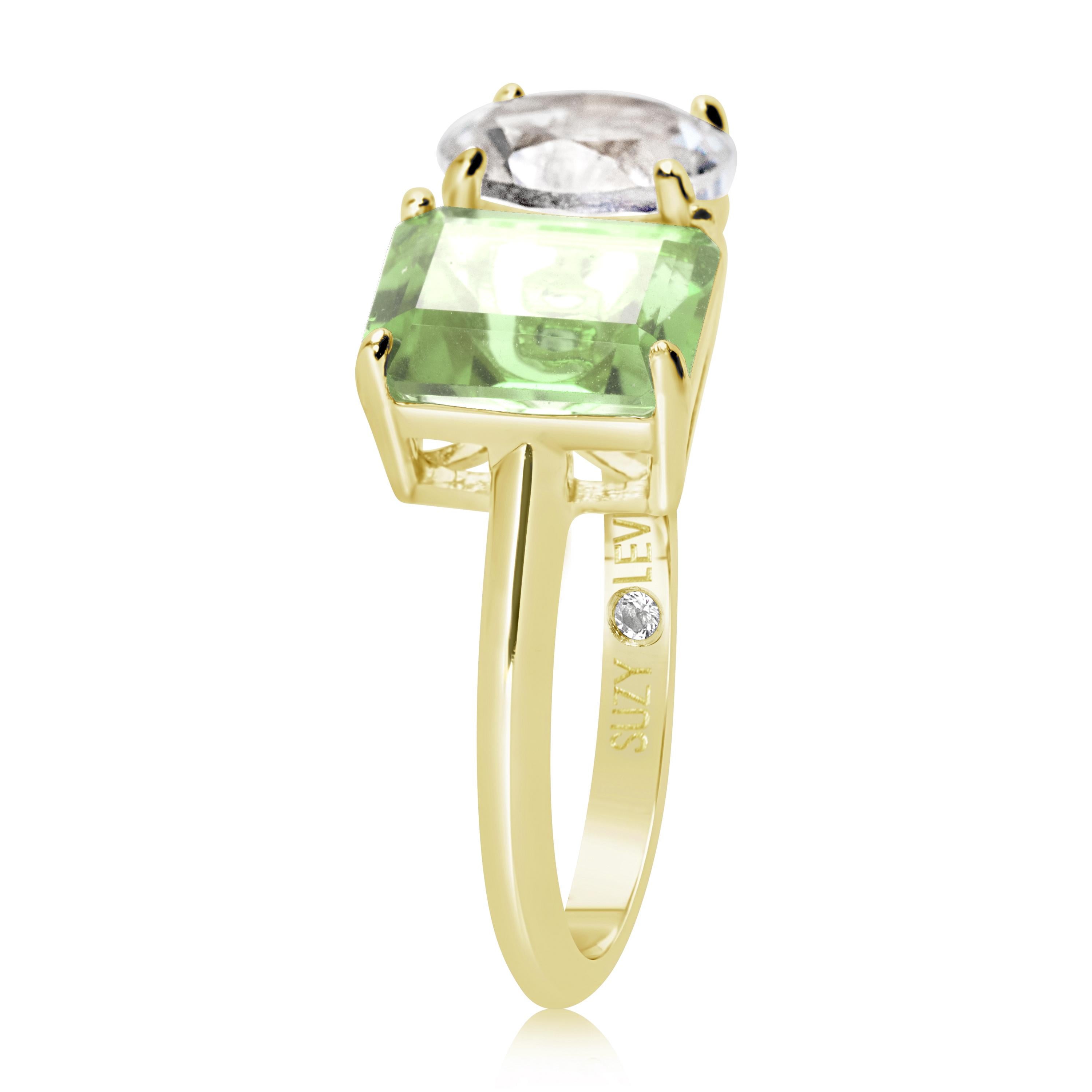 Shimmering in hues of white and green, this Suzy Levian ring is as on trend as can be, and features a round cut white topaz and an emerald cut green amethyst as a perfectly matched pair. This ring symbolizes a perfect pairing of unique shapes. This