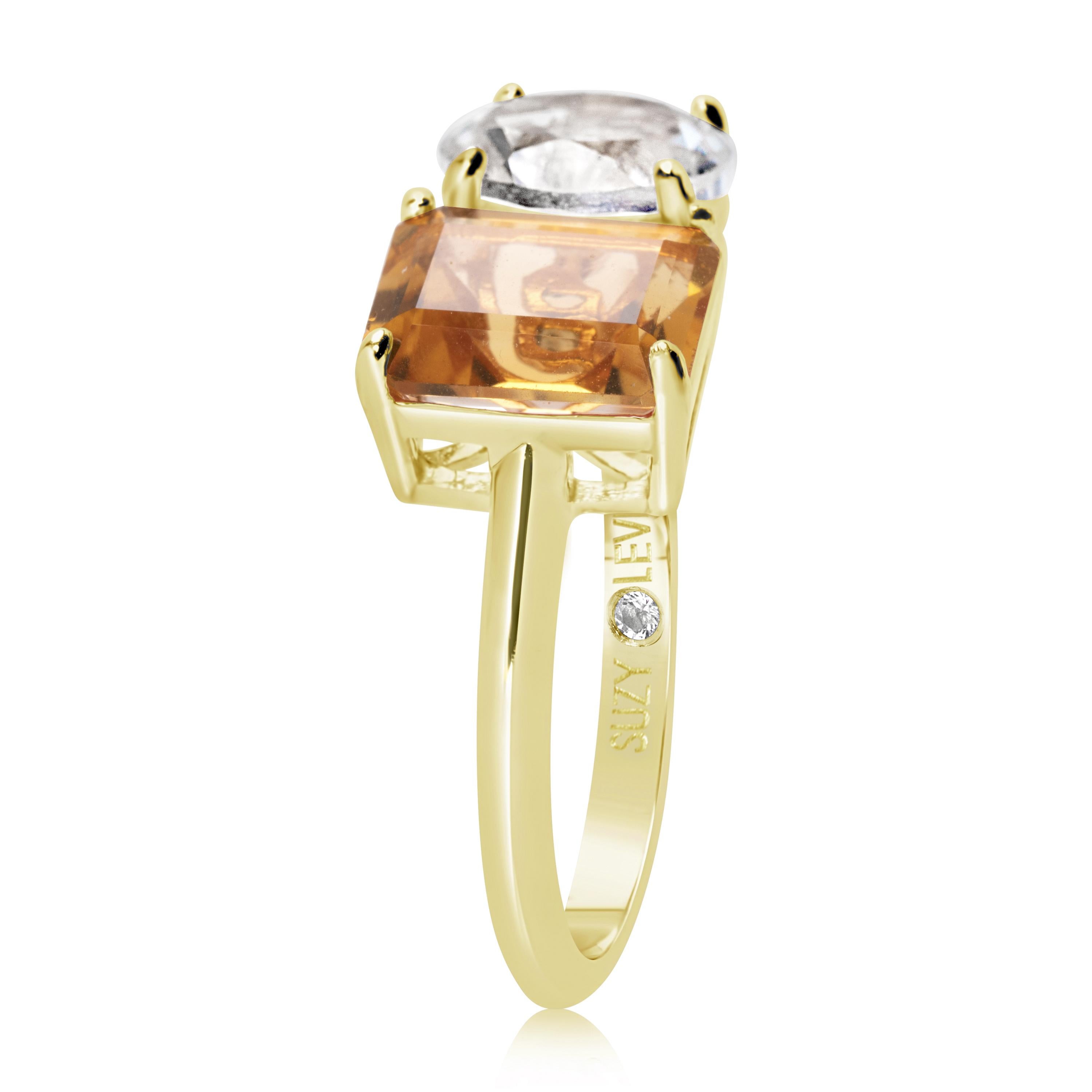 Shimmering in hues of white and orange, this Suzy Levian ring is as on trend as can be, and features a round cut white topaz and an emerald cut orange citrine as a perfectly matched pair. This ring symbolizes a perfect pairing of unique shapes. This