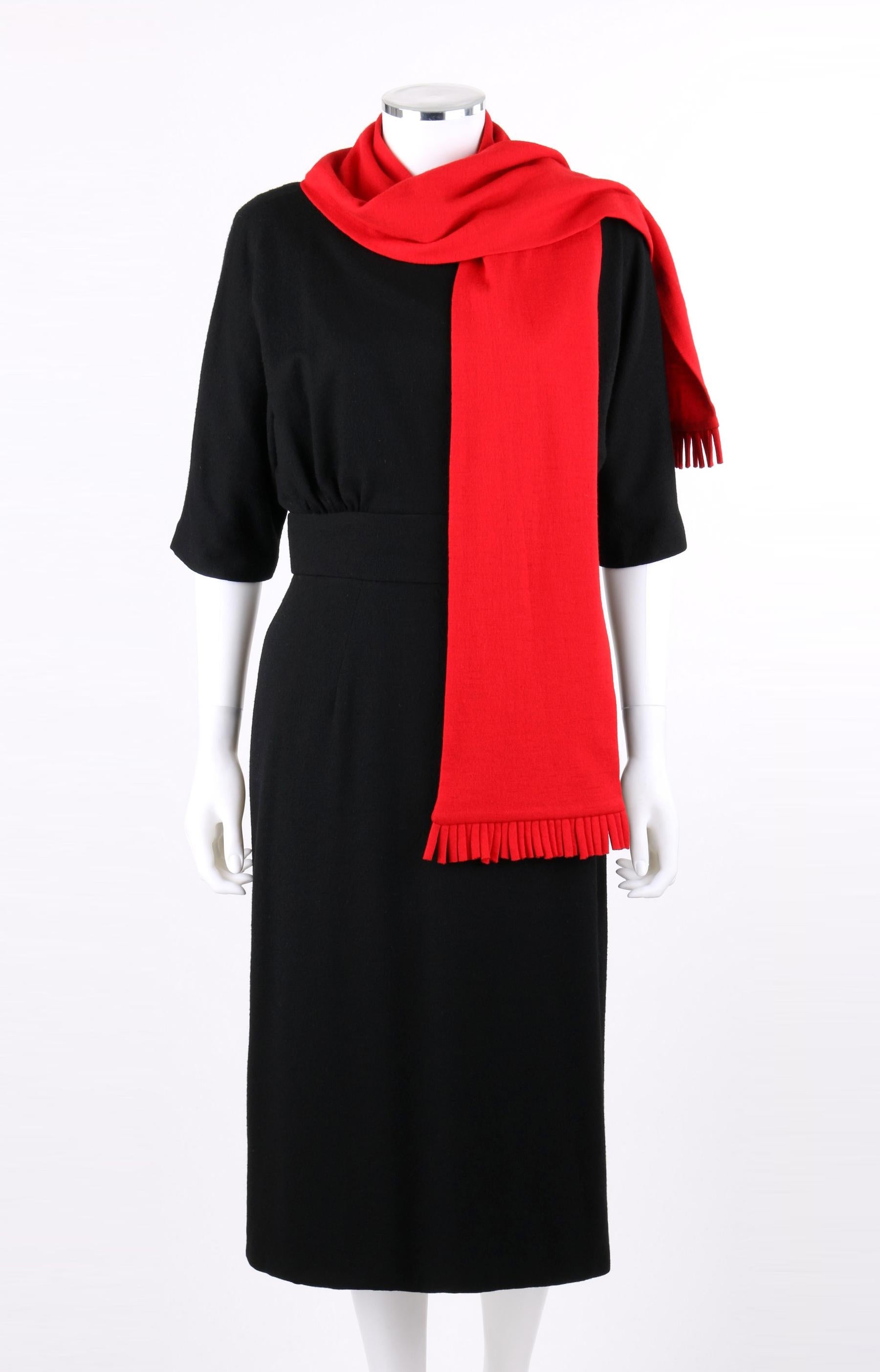 DESCRIPTION: SUZY PERETTE c.1960s 2Pc Black Dolman Sleeve Knit Cocktail Dress w/ Fringe Scarf
 
Circa: c.1960’s
Label(s): Suzy Perette New York; Union Label 
Designer: Evelyn Dawson
Style: Shift dress
Color(s): Black and red
Lined: Yes
Unmarked