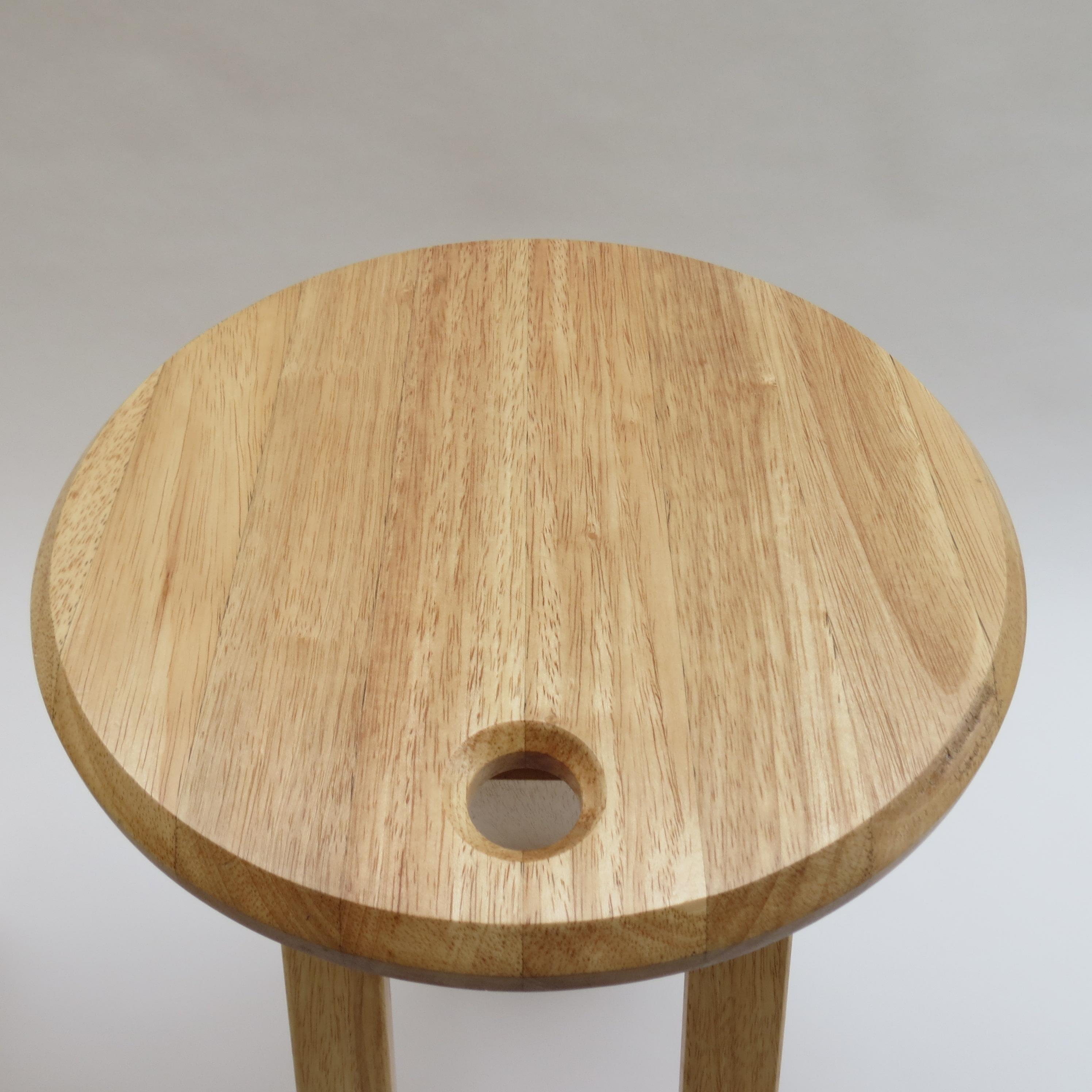 A folding Suzy stool, designed by Adrian Reed and produced by Princes Design Works in 1984-1985.

Made from solid deal, the stools fold and can be hung up for ease of storage. This stool retains the original peg for hanging the stool.

Sticker
