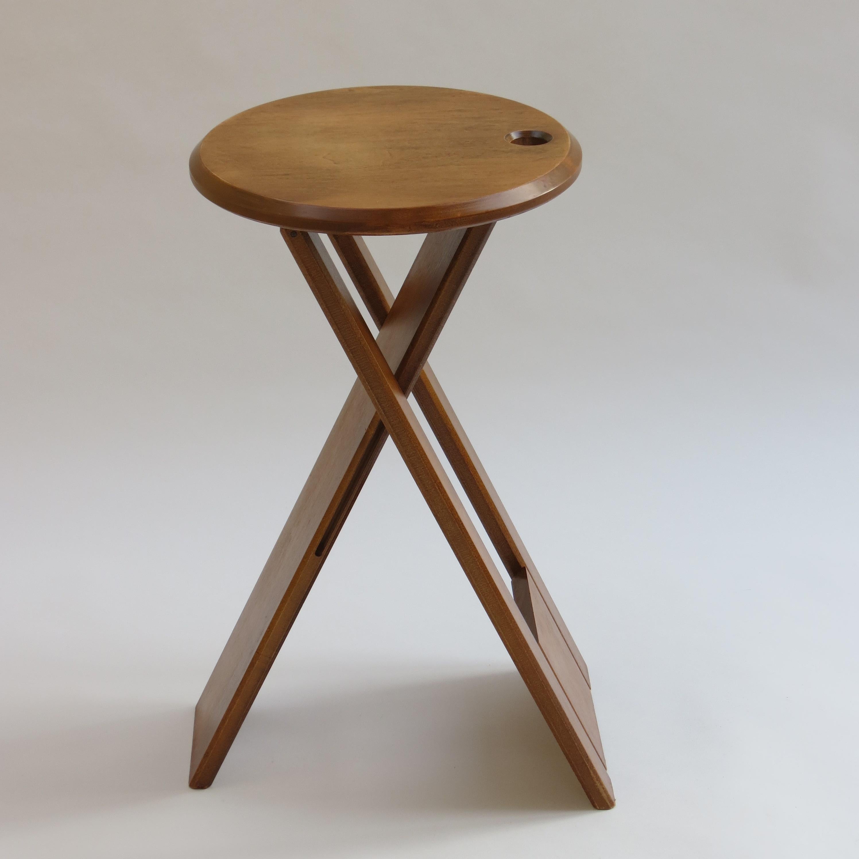 A folding Suzy stool, designed by Adrian Reed and produced by Princes Design Works in 1984-1985.
Made from solid birch, the stool folds and can be hung up for ease of storage.
Good vintage condition, general signs of use.



  