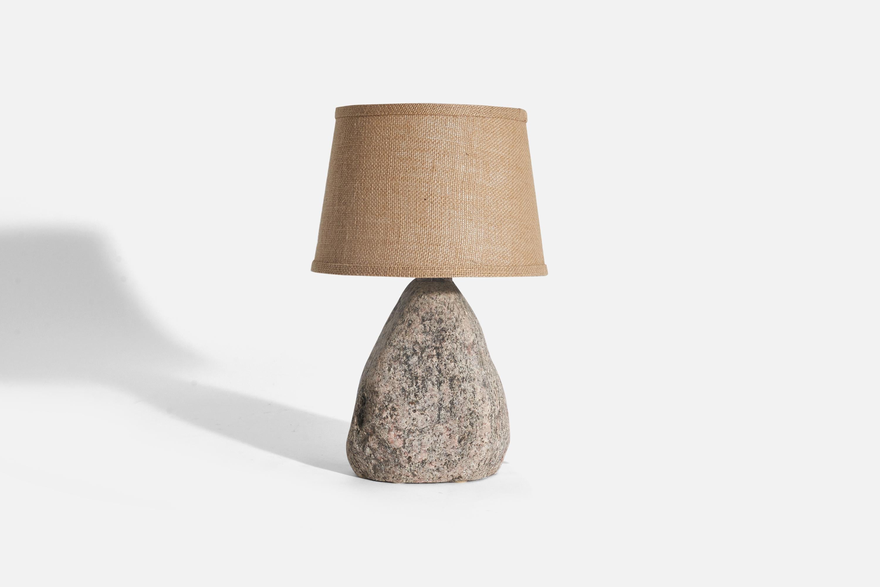 A stone table lamp designed and produced by Svane Stone AB, Sweden, c. 1970s.

Sold with fabric lampshade(s)
Dimensions of lamp (inches) : 11.87 x 7.06 x 4.43 (Height x Width x Depth)
Dimensions of shade (inches) : 8.25 x 10.37 x 7.12 (Top