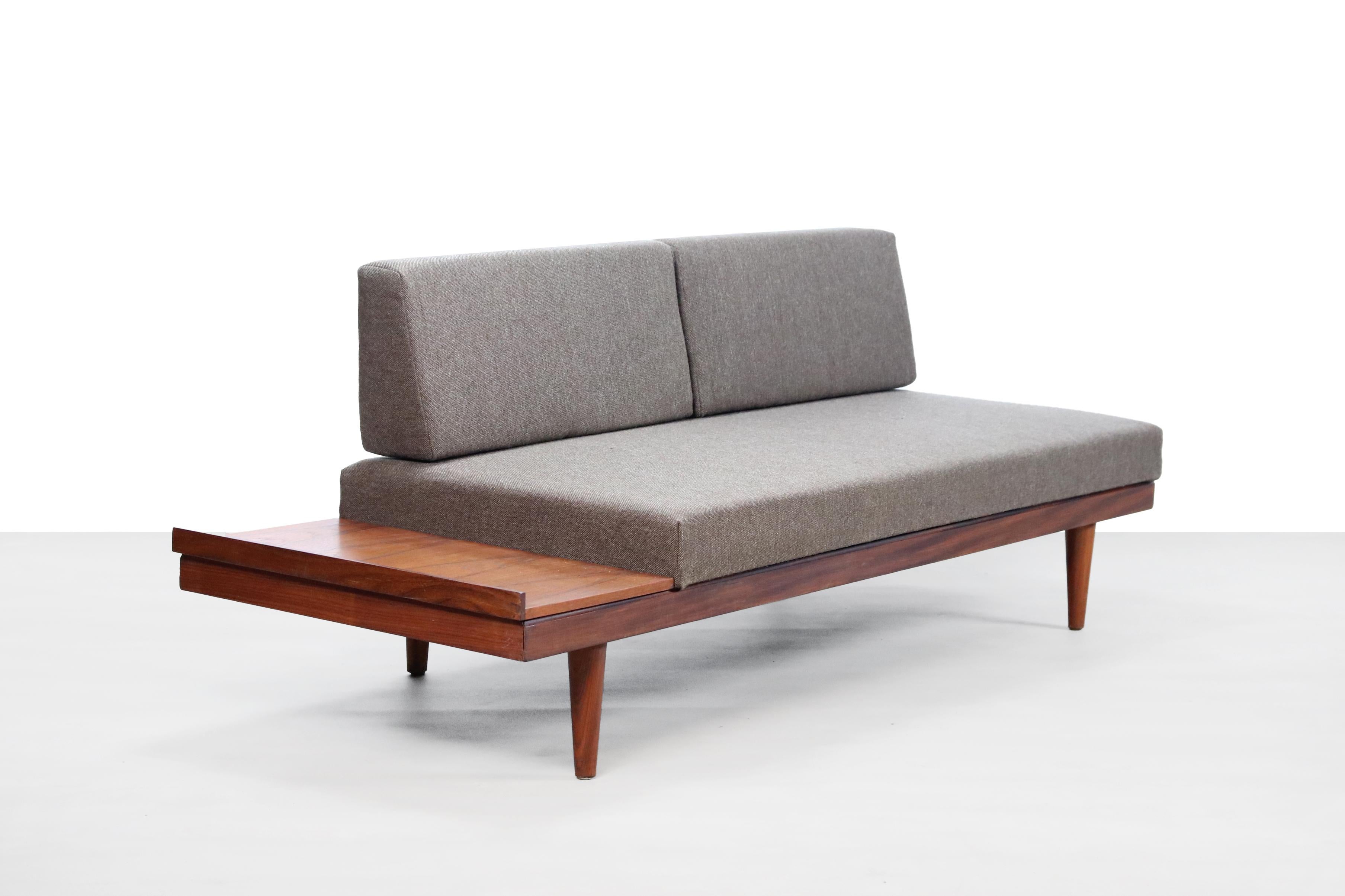This hard to find sofa from Norway can be transformed into a single bed in no time. By placing a cushion from the backrest on the side table you have a bed with a length of 192 cm. A beautiful design by Ingmar Relling for Ekornes, Norway.
This