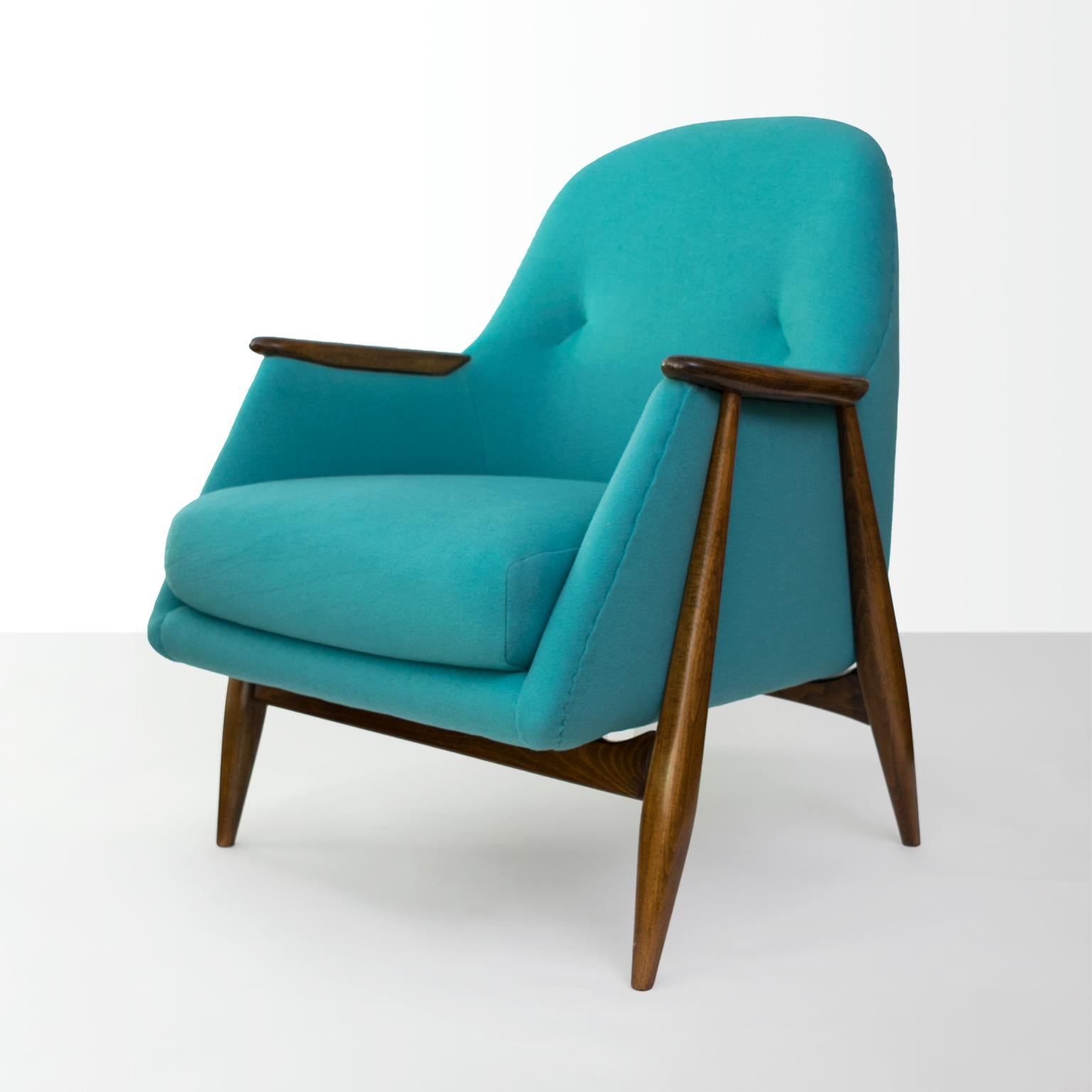 A Scandinavian Modern upholstered armchair with carved stained wood frame designed by Svante Skogh for Asko, Finland, 1954. Newly refinished and upholstered in soft 100% wool fabric.

Measures: Height 32.5