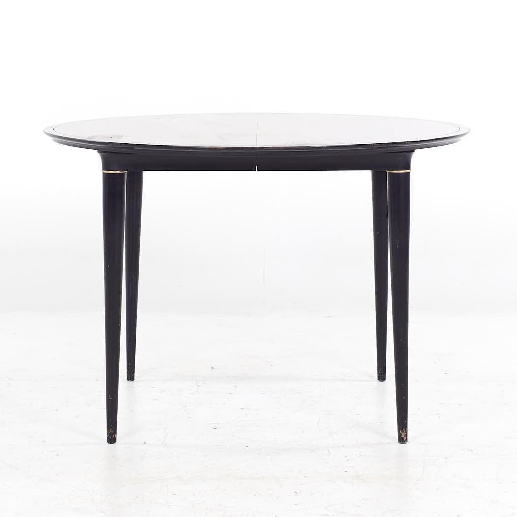 Svante Skogh for Seffle of Sweden Mid Century Ebonized and Rosewood Expanding Dining Table with 3 Leaves

This table measures: 44 wide x 44 deep x 29 inches high, with a chair clearance of 26 inches, each leaf measures 11.5 inches wide, making a