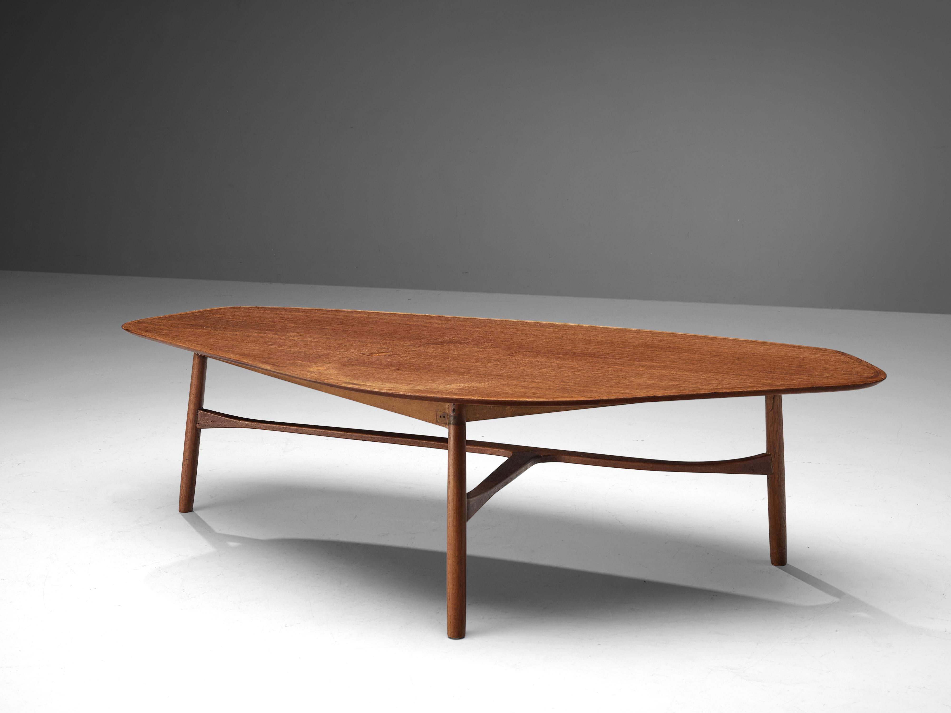 Svante Skogh, coffee table, teak, Sweden, 1950s

This freely shaped coffee table with three thin tapered legs is part is beautifully shaped and shows high attention to detail, especially by means of the connecting tripod slat between the legs.
