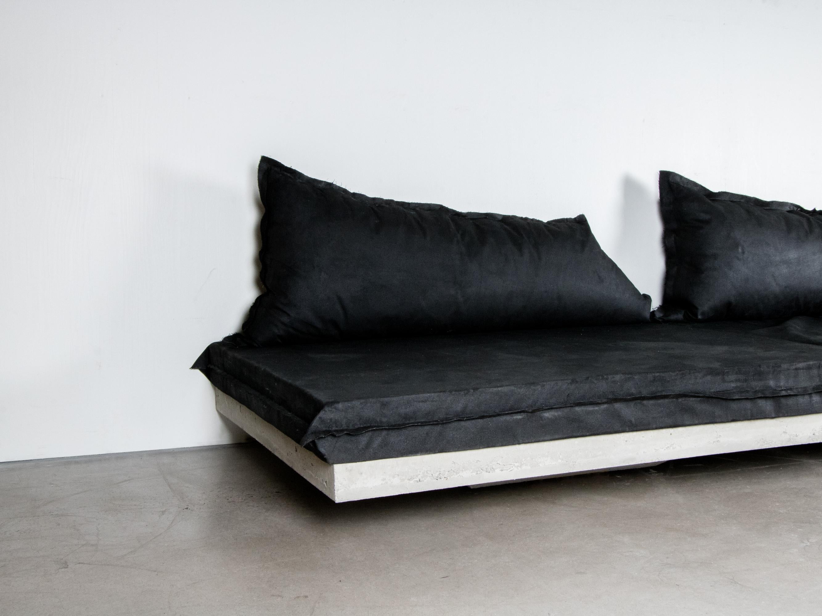 Svav sofa by Lucas Morten
2020
Limited edition of 19
Price per module
Module dimensions: H 32, D 110, W 140 cm
Module weight: 100 kg.
Material: concrete and hand-waxed upholstered cushion.


A floating concrete raft - an illusion or an actuality.