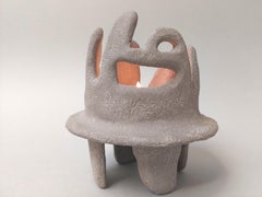 Small abstract sculpture. Ancient candle holder.