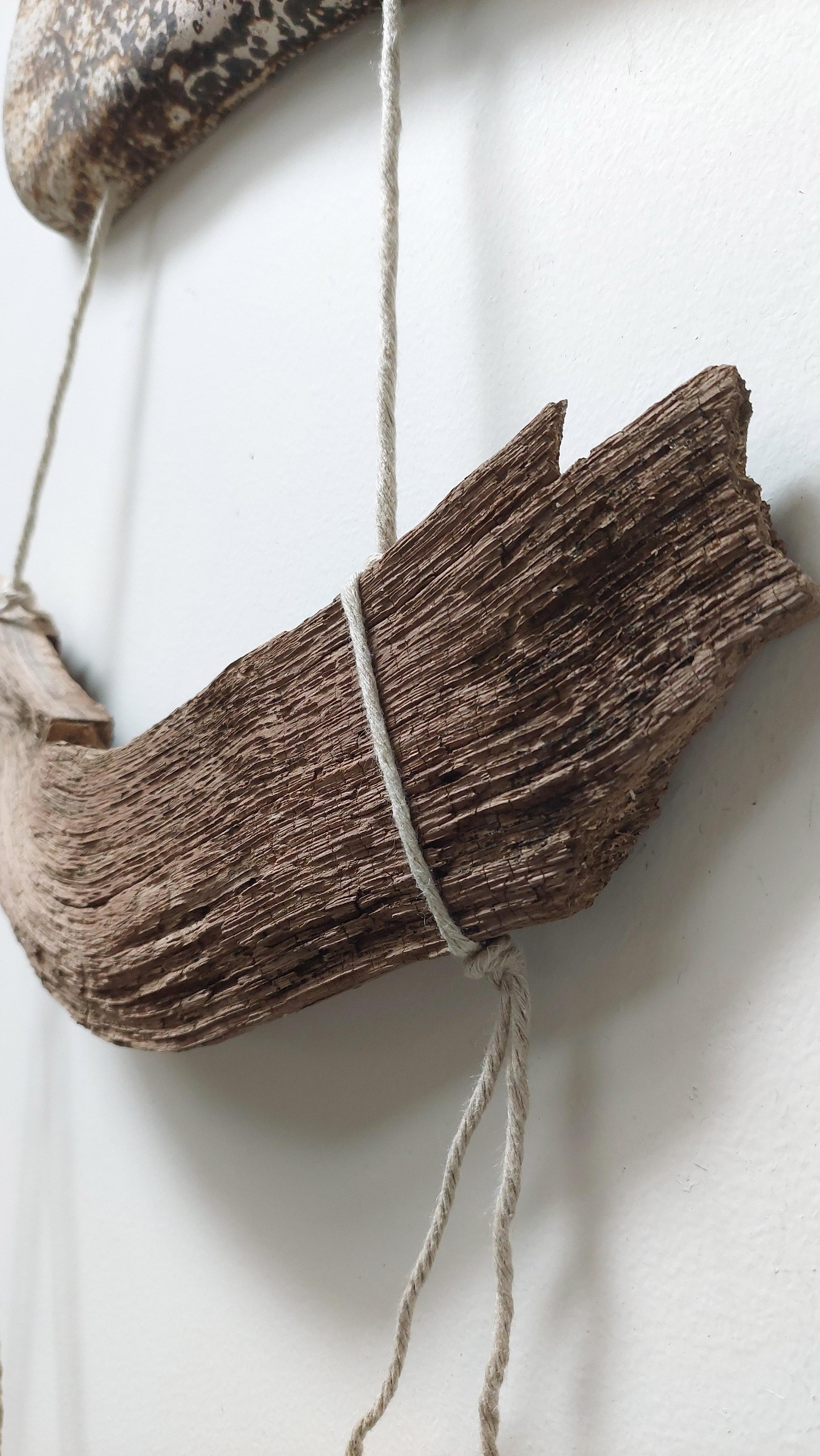 This wall hanging is made in a natural boho style. I combined a ceramic art piece and a piece of wood, connecting them with linen rope. The ceramic part is decorated using the ancient technology of Obvara Firing. «I take a scorching, red-hot ceramic