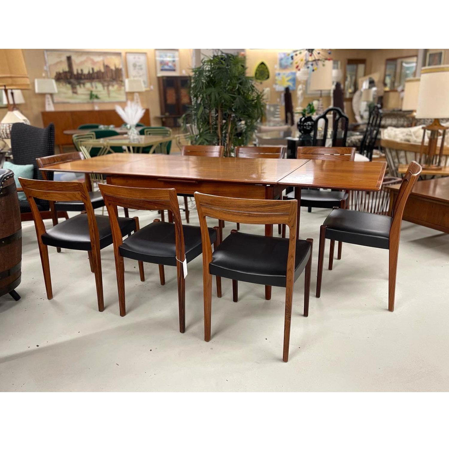Set of 8 Svegards Markaryd rosewood dining chairs made in Sweden. The vintage Danish Modern style dining chairs were actually born and bred in neighboring Sweden. Craftsmanship is second to none and our restoration team did a knock out job on the