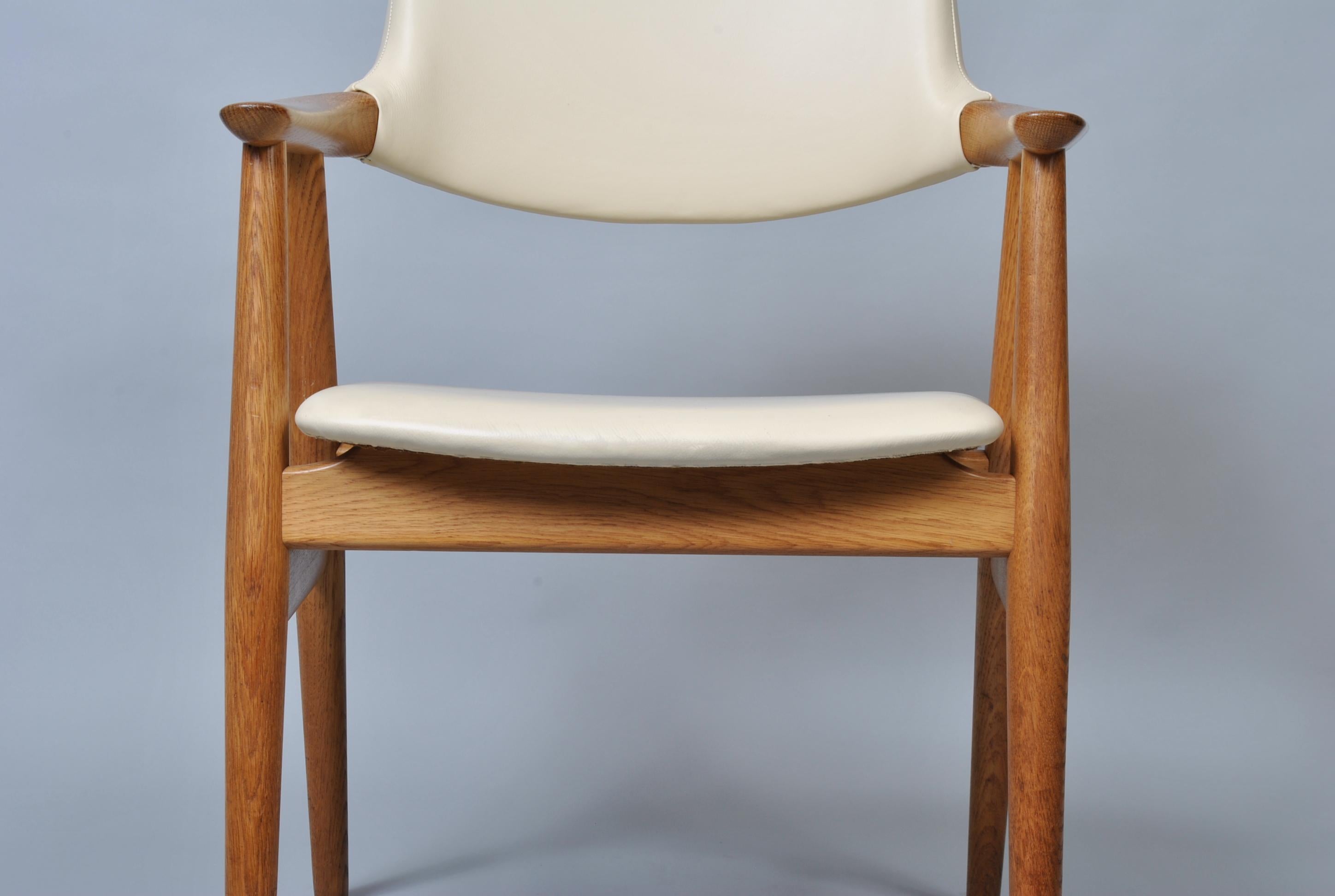 White European oak armchair by Sven Aage Eriksen for Glostrup, Denmark, circa 1960. Refurbished oak frames upholstered in off white leather.
Incredibly comfortable.
 