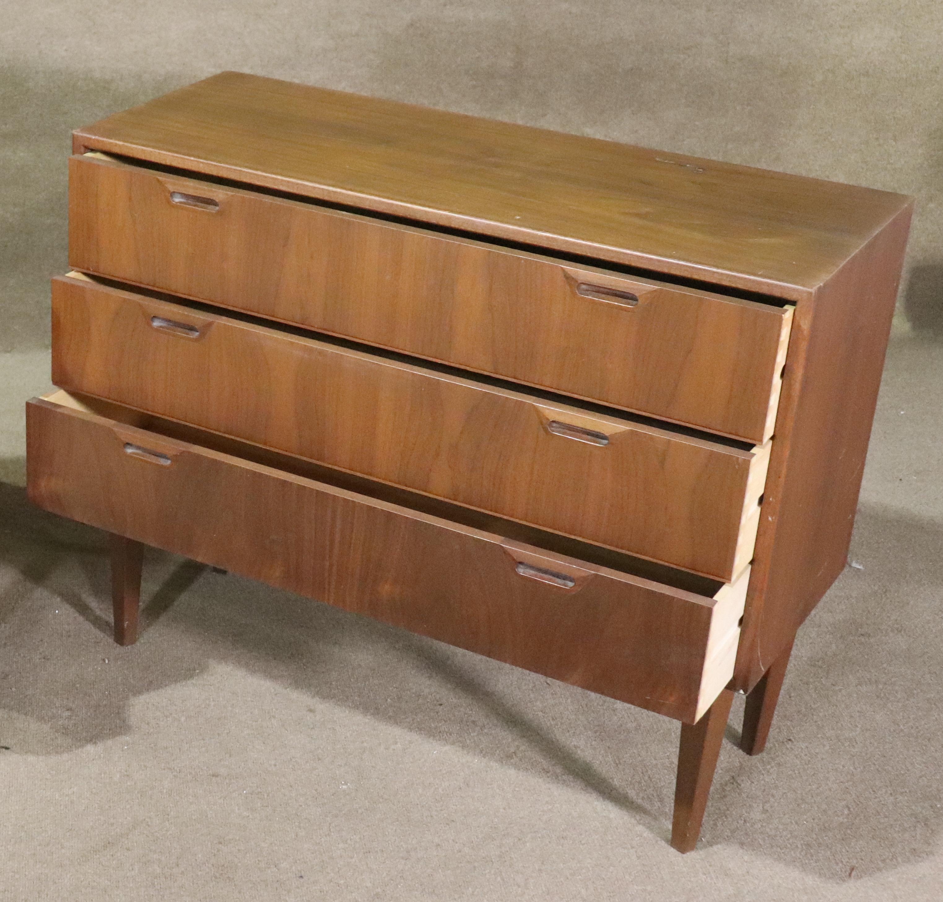 Mid-Century Modern chest of drawers by Sven Ellekaer for Albert Hansen. Originally made as a floating wall unit with metal brackets on the back. Tapered legs added.
Please confirm location NY or NJ.