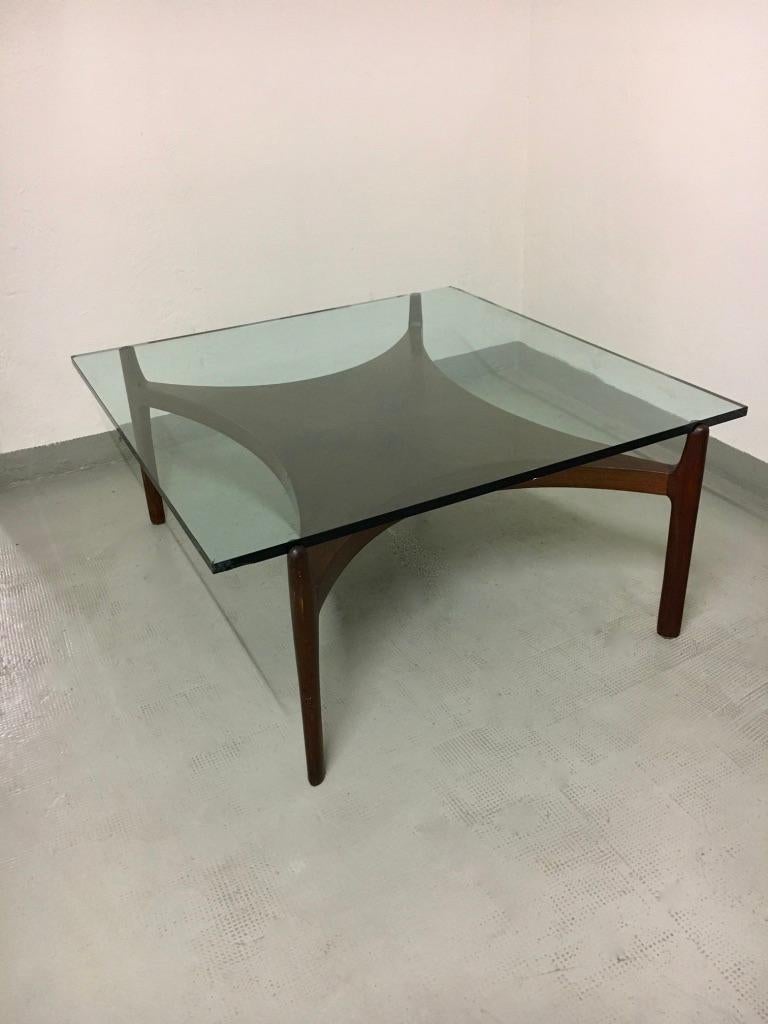 Vintage teak and thick glass coffee table by Sven Ellekaer produced by Christian Linneberg, Denmark, circa 1960s
Manufacturer label underneath. Good vintage condition
The table will be sold with a new identical glass top.
Measures: 100 x 100 x 45