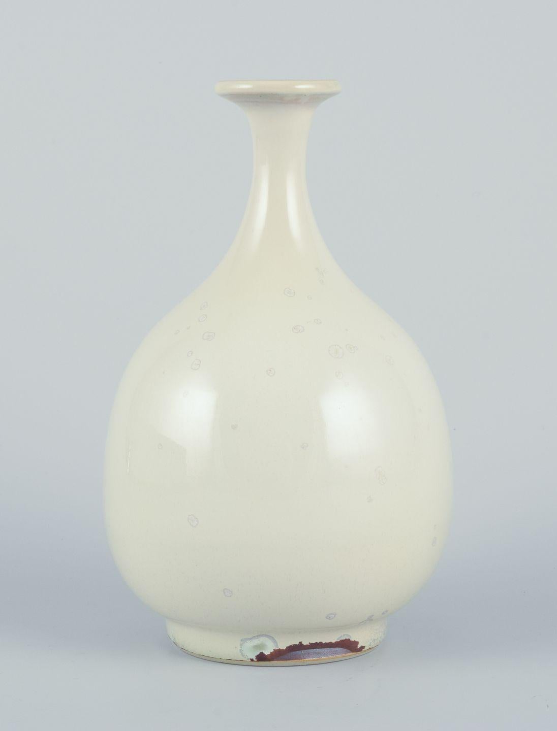 Pre-owned goods are exempt from import duties for U.S. customers. 
Therefore, no import tariffs will be applicable to your purchase.

Sven Hofverberg, Swedish ceramicist, own studio.
Unique ceramic vase.
Slender neck.
Light crystal glaze.
Late 20th