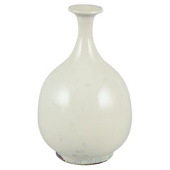 Sven Hofverberg, Swedish ceramicist, own studio. Ceramic vase with slender neck.