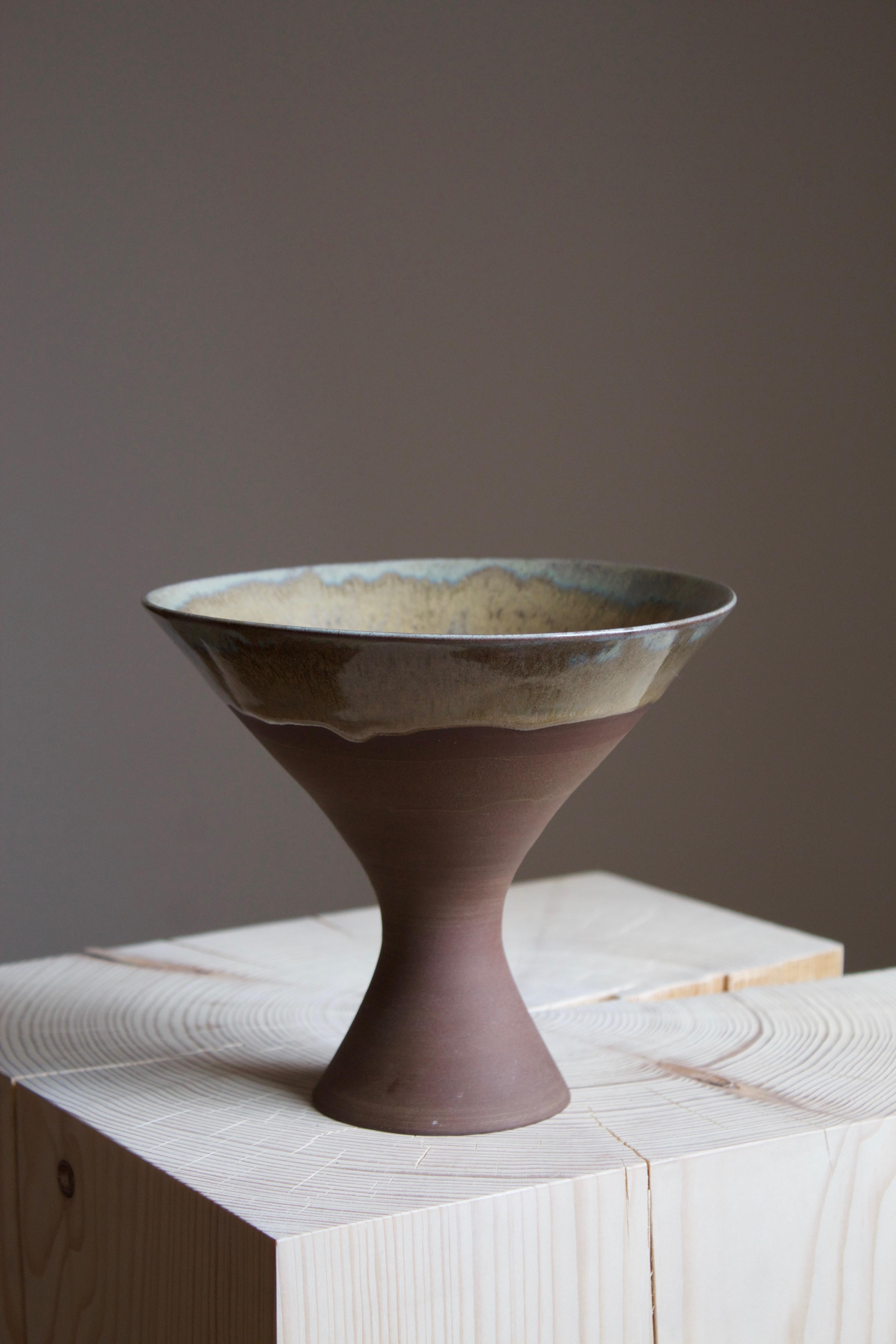 A vase or bowl, produced by Sven Hofverberg in his own studio, Landskrona, Sweden, 1970s. Signed. 

Other designers of the period include Lucie Rie, Carl Harry Stålhane, Hans Cooper, and Saxbo.