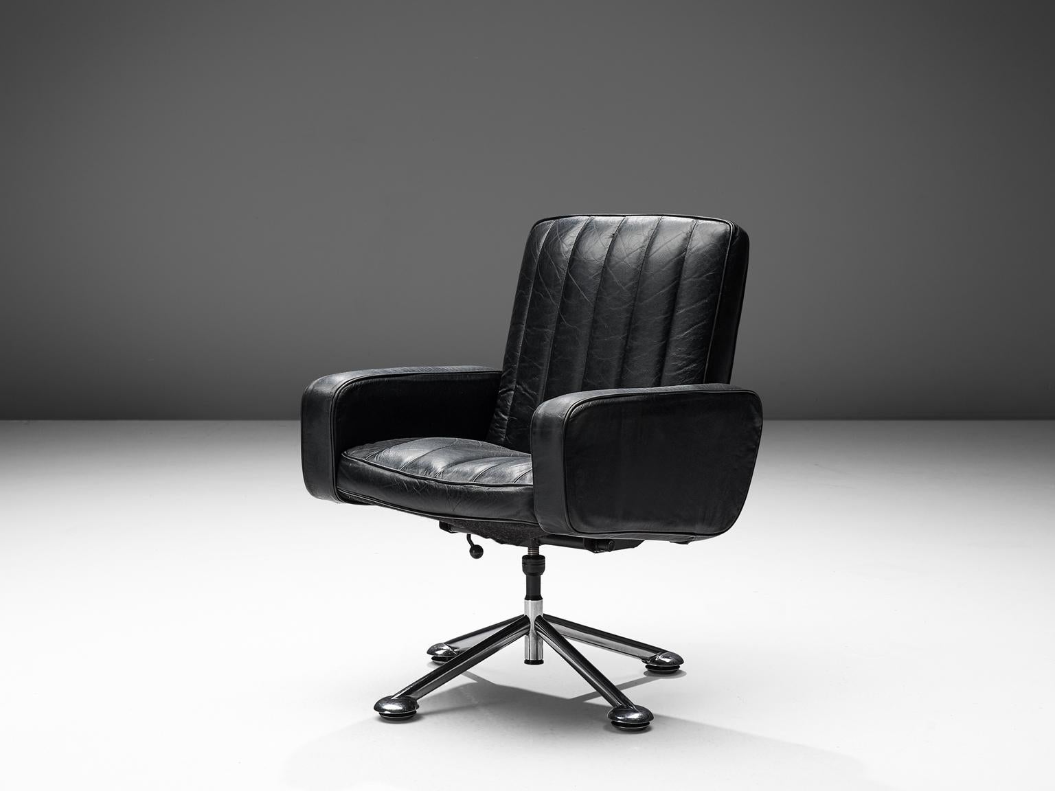 Sven Ivar Dysthe for Dokke Møbler, desk chair, black leather, steel, Norway, circa 1959. 

The base of this office chairs is made out of steel and stainless steel and the seat is made of black channeled leather. The seat is covered in their