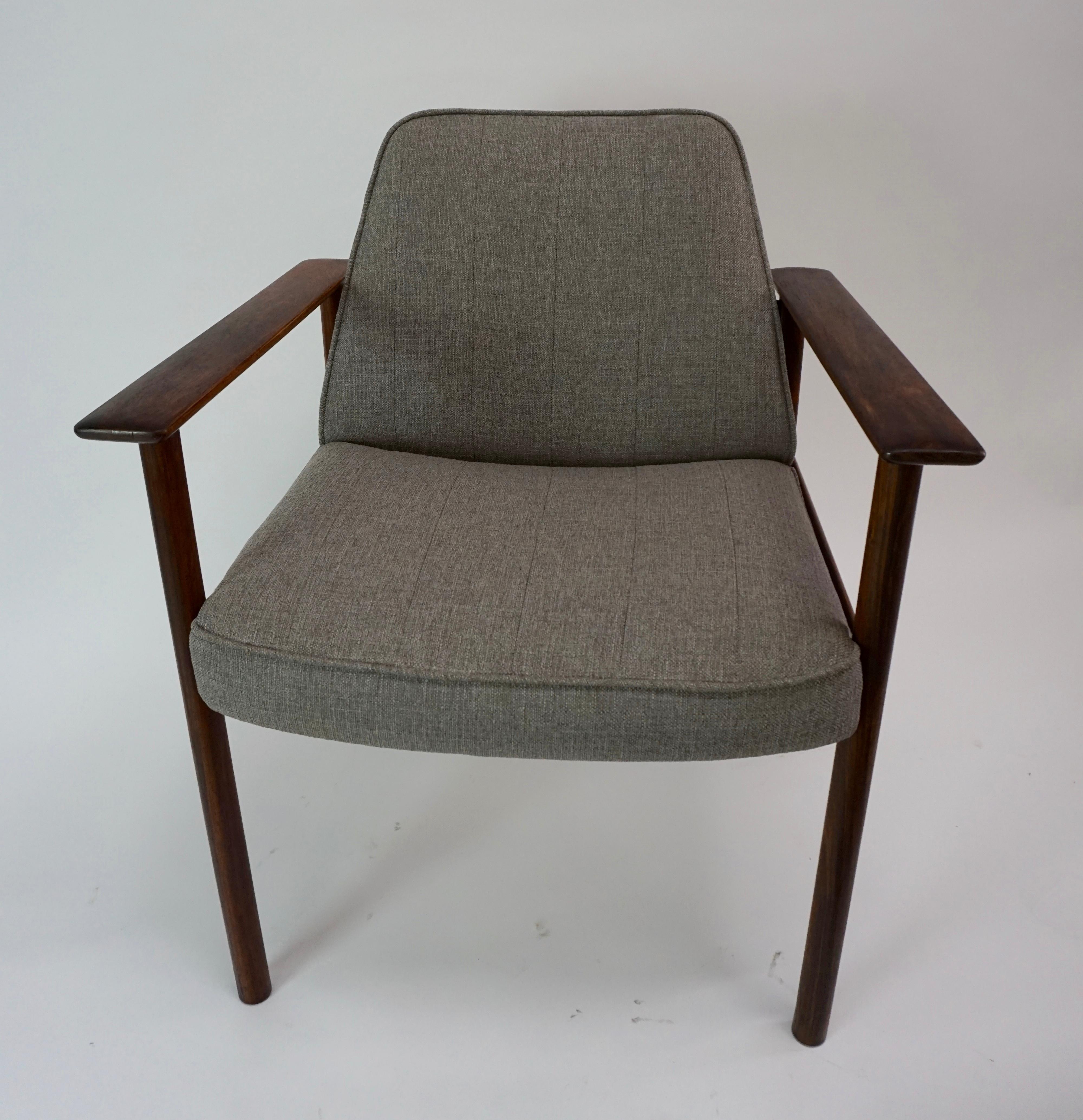 Pair of solid rosewood chairs have new foam and strapping, along with fabric. Textured fabric is a warm grey color. There is a subtle stitching detail in upholstery, as noted in second photo. This set is labelled. Made in Norway.