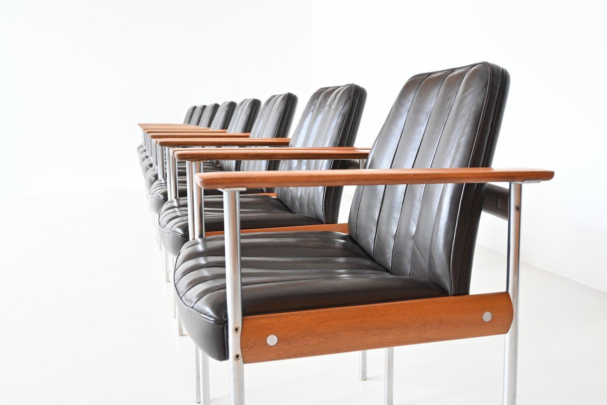 Very nice and rare set of eight armchairs model 1001 designed by Sven Ivar Dysthe for Dokka Møbler, Norway 1960. These office or dining chairs have a base made of walnut wood and stainless steel pieces and the shell is upholstered in original dark