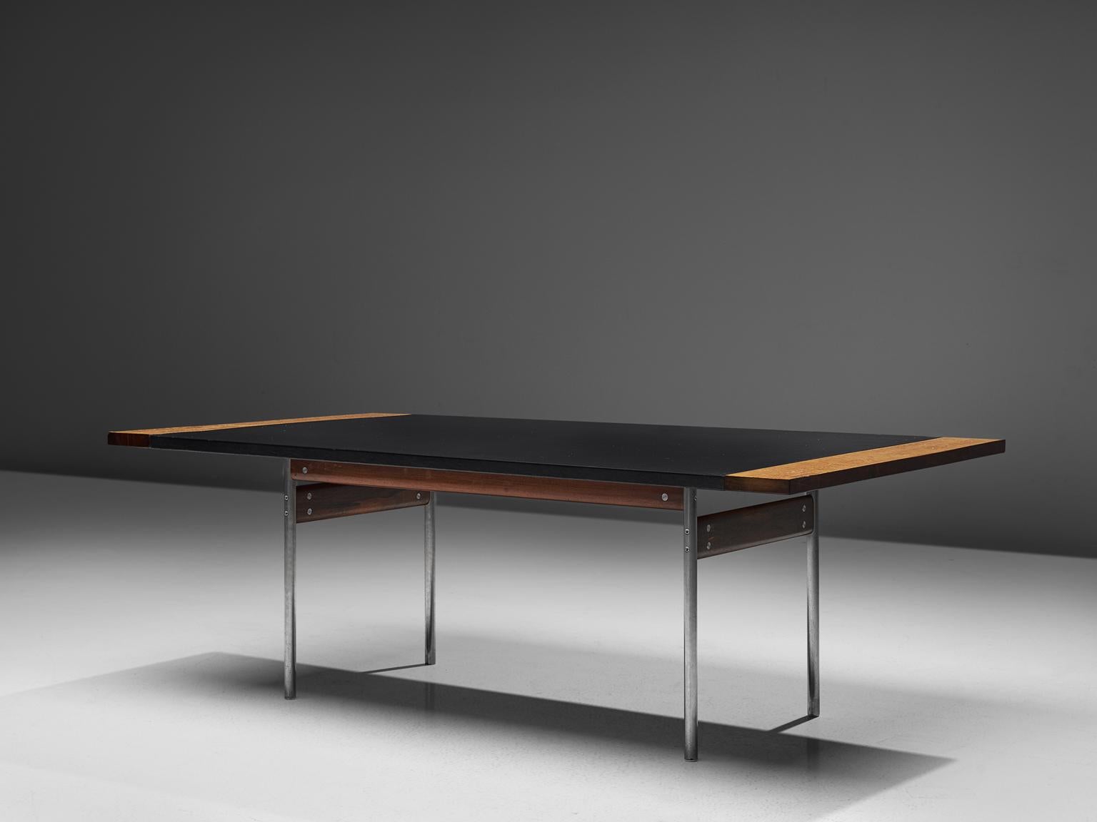 Sven Ivar Dysthe for Dokka, table, leather, rosewood and steel, Norway, 1960s.

This well crafted executive dining table in walnut is designed by Sven Ivar Dysthe. The tabletop is finished with luxurious black leather, which shows minor signs of