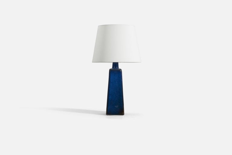 A blue-glazed stoneware table lamp designed by Sven Jonson, produced by Gustavsberg, Sweden, c. 1950s-1960s. 

Sold without lampshade.
Measurements listed are of lamp itself. 
Measurements of illustrated lampshade : 9 x 12 x 9 - (T x B x