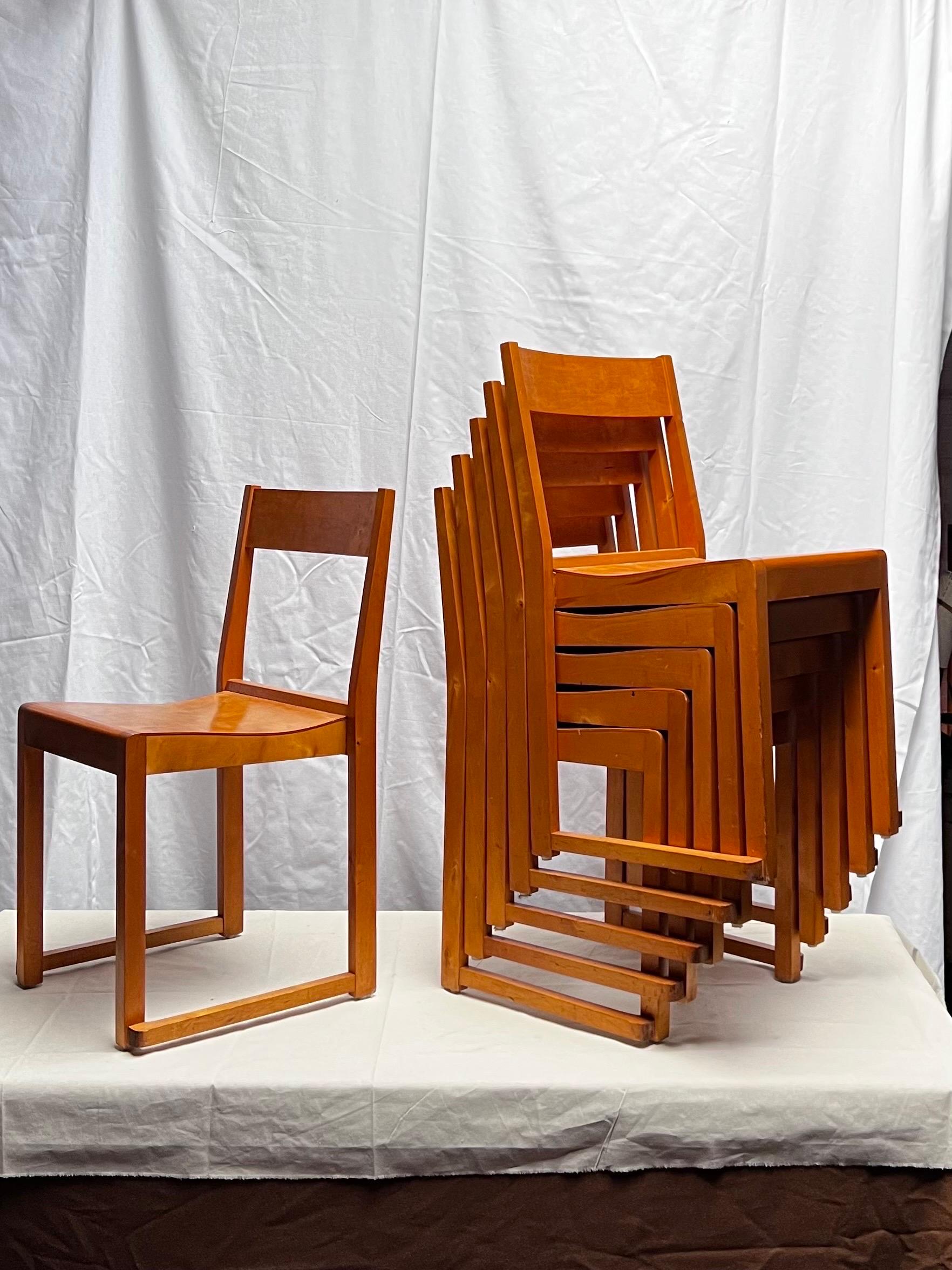 Set of 6 minimal and elegant lightweight confortable stacking chairs by modernist architect Sven Markelius. Designed and produced for the orchestra of the Helsingborg theater in Sweden in 1931. These are honey brown stained birch in very unusual