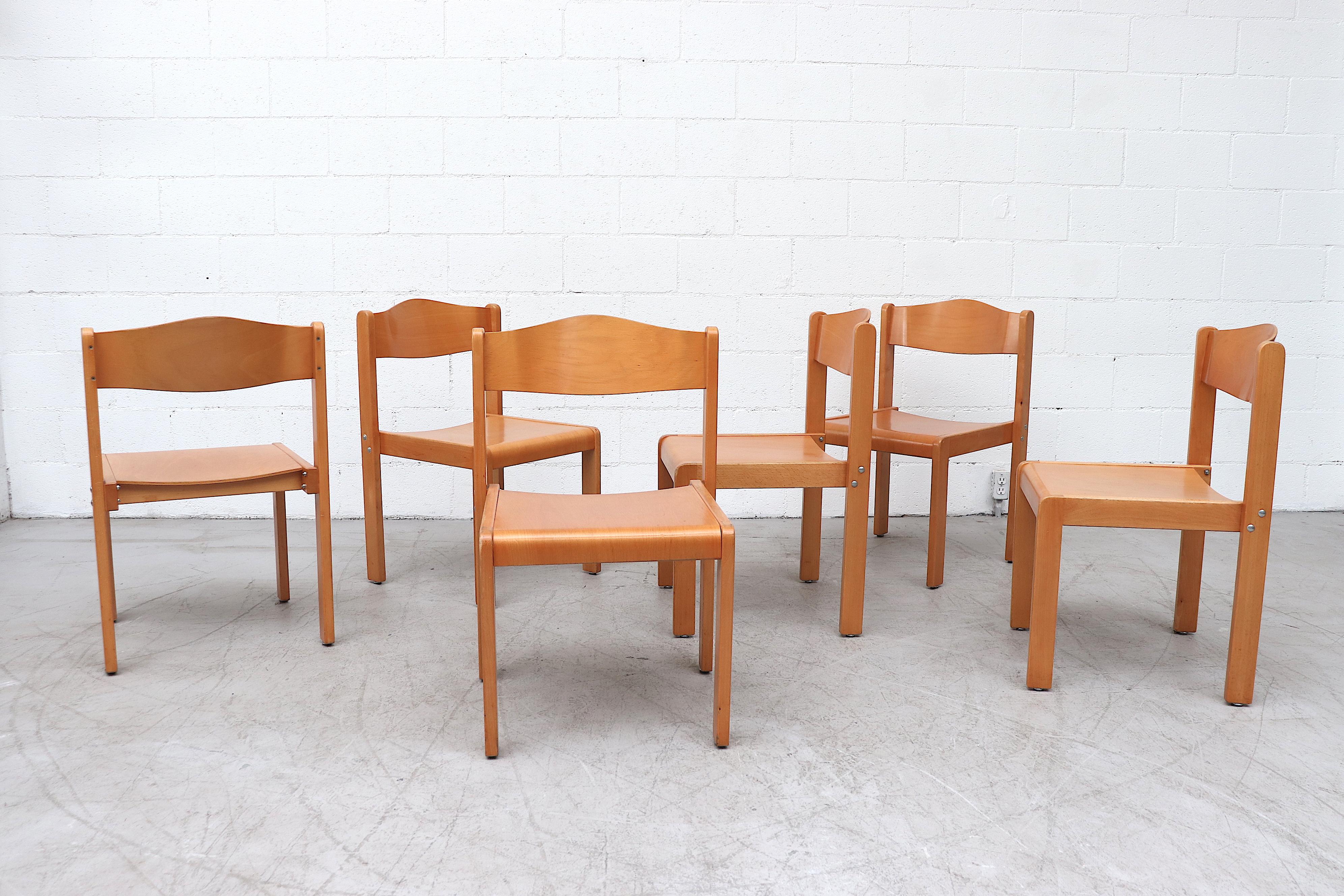 Set of 8 Sven Markelius style birch stacking chairs. In original condition with visible wear consistent with their age and use. Priced as a set of 8. The seat measures 19