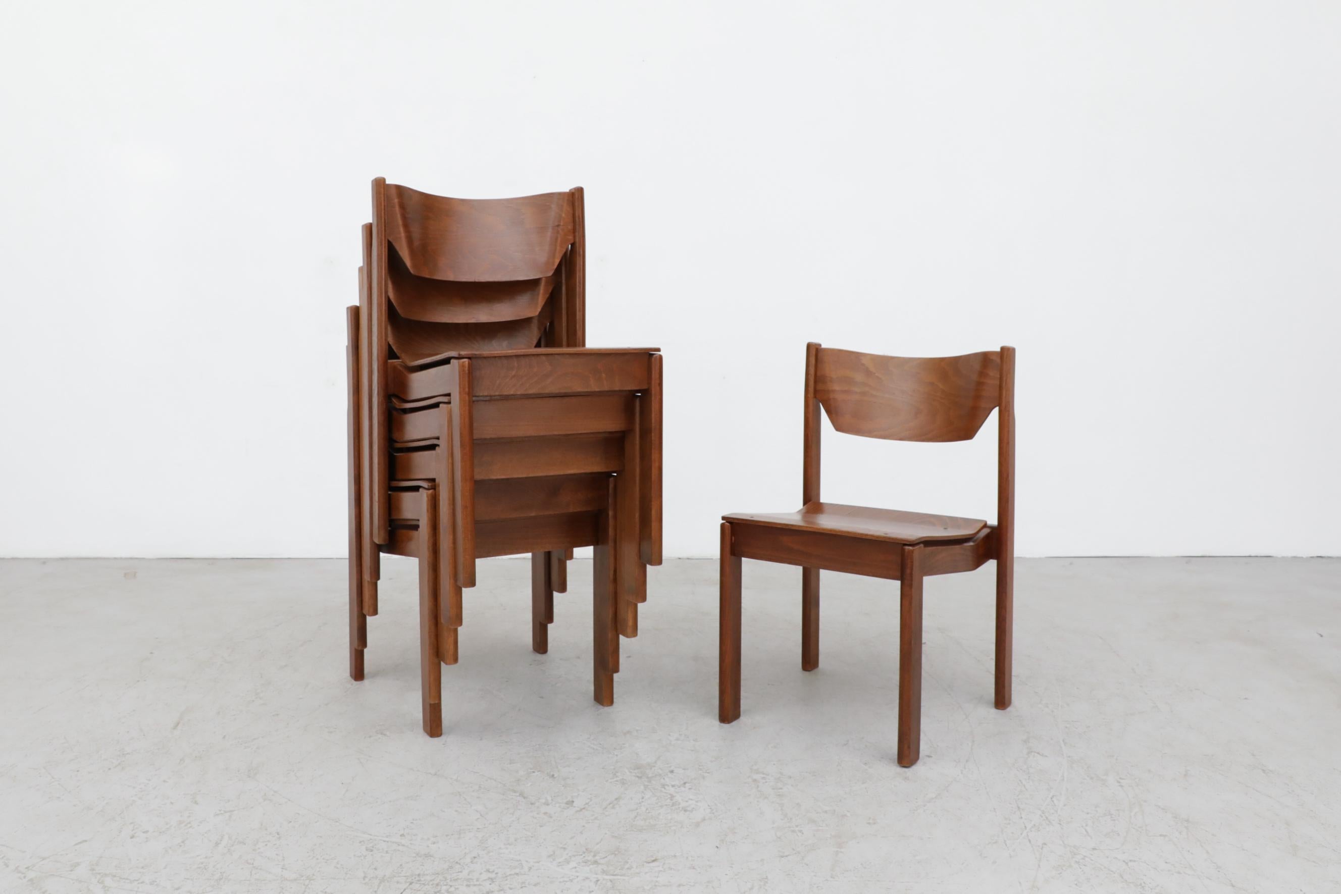 Lightly refinished Sven Markelius style dark stained birch stacking chairs. In lightly refinished but overall great condition with some visible wear and scratching.
