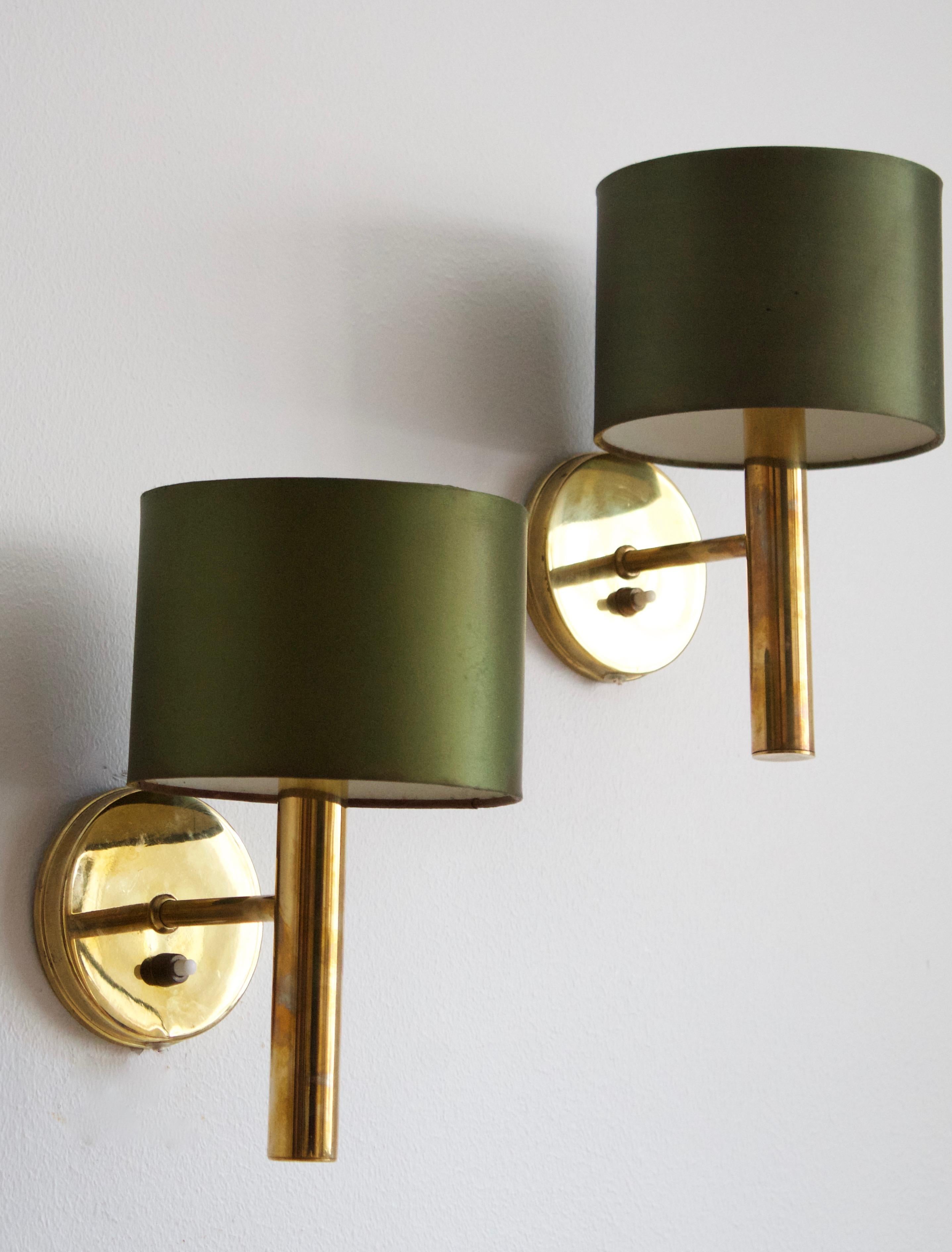 A pair of wall lights or sconces designed by S.O.A. Mejlstrøm, for MS Belysning, Denmark, 1960s. In brass, with its original green velvet lampshades. Labeled.