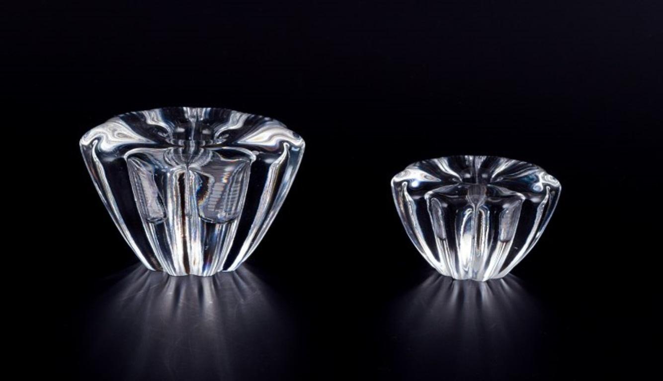 Sven Palmqvist for Orrefors, Sweden. 
Four art glass candleholders in crystal glass, two different sizes.
Mid-20th century.
Partly signed OF.
Perfect condition.
Dimensions small: Height 4.0 cm x 7.0 cm.
Dimensions large: Height 5.5 cm x 9.0