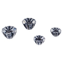 Sven Palmqvist for Orrefors. Four art glass candle holders in crystal glass