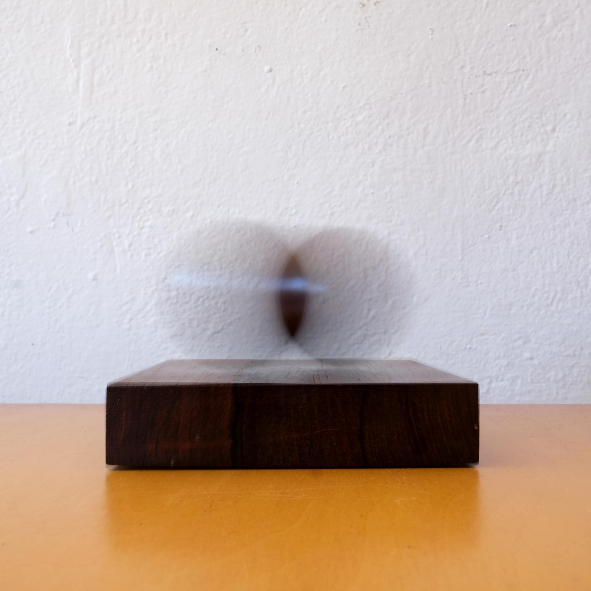 Rosewood kinetic sculpture by Sven Petersen for SAAP. The rosewood ball moves back and forth after pulled and released. 

From the estate of the owners of Frank Bros, the revolutionary design store that provided furnishings to many of the Case
