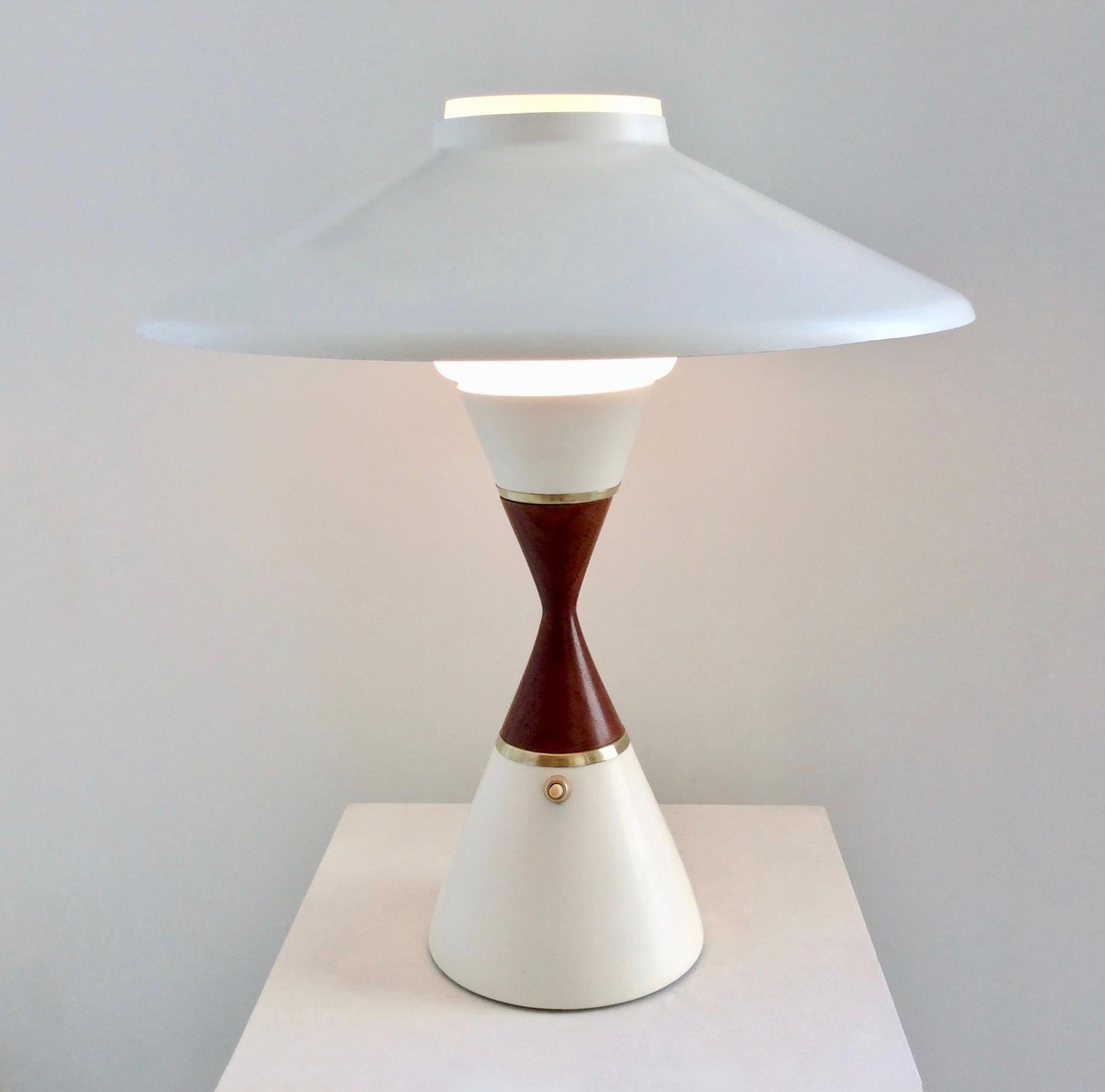 Nice Svend Middelboe table lamp for Nordic Solar, circa 1950, Denmark.
White lacquered metal base and shade, opaline glass, teak and brass details.
One E27 bulb.
Dimensions: 41 cm height, diameter 39 cm.
Good condition.
All purchases are covered by
