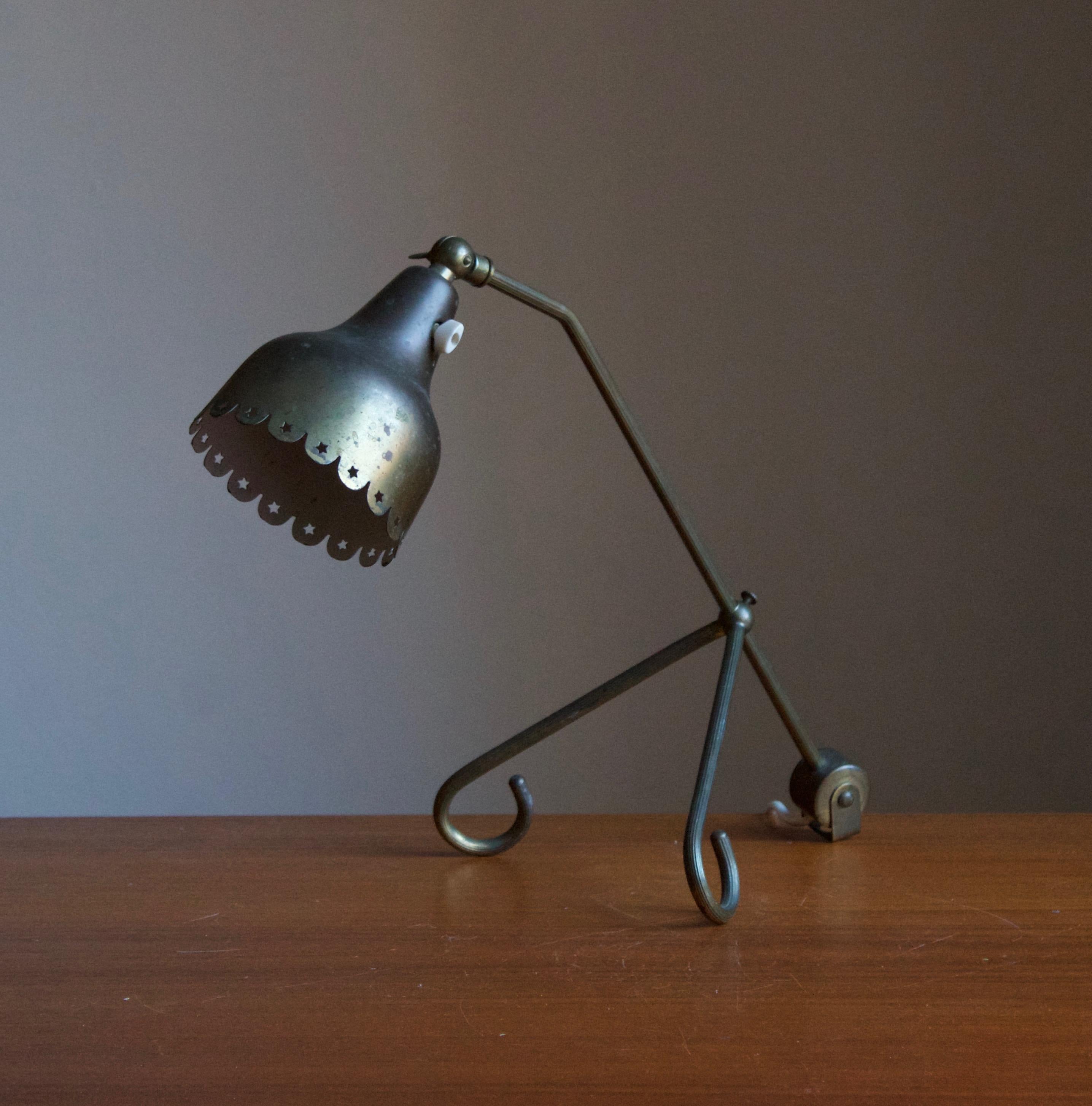 A table lamp / desk light, by Svend Aage Holm Sørensen, Denmark, 1950s. Adjustable, and can be utilized as a wall light in addition.

Other designers of the period include Paavo Tynell, Serge Mouille, Josef Frank, Angelo Lelii, and Lisa